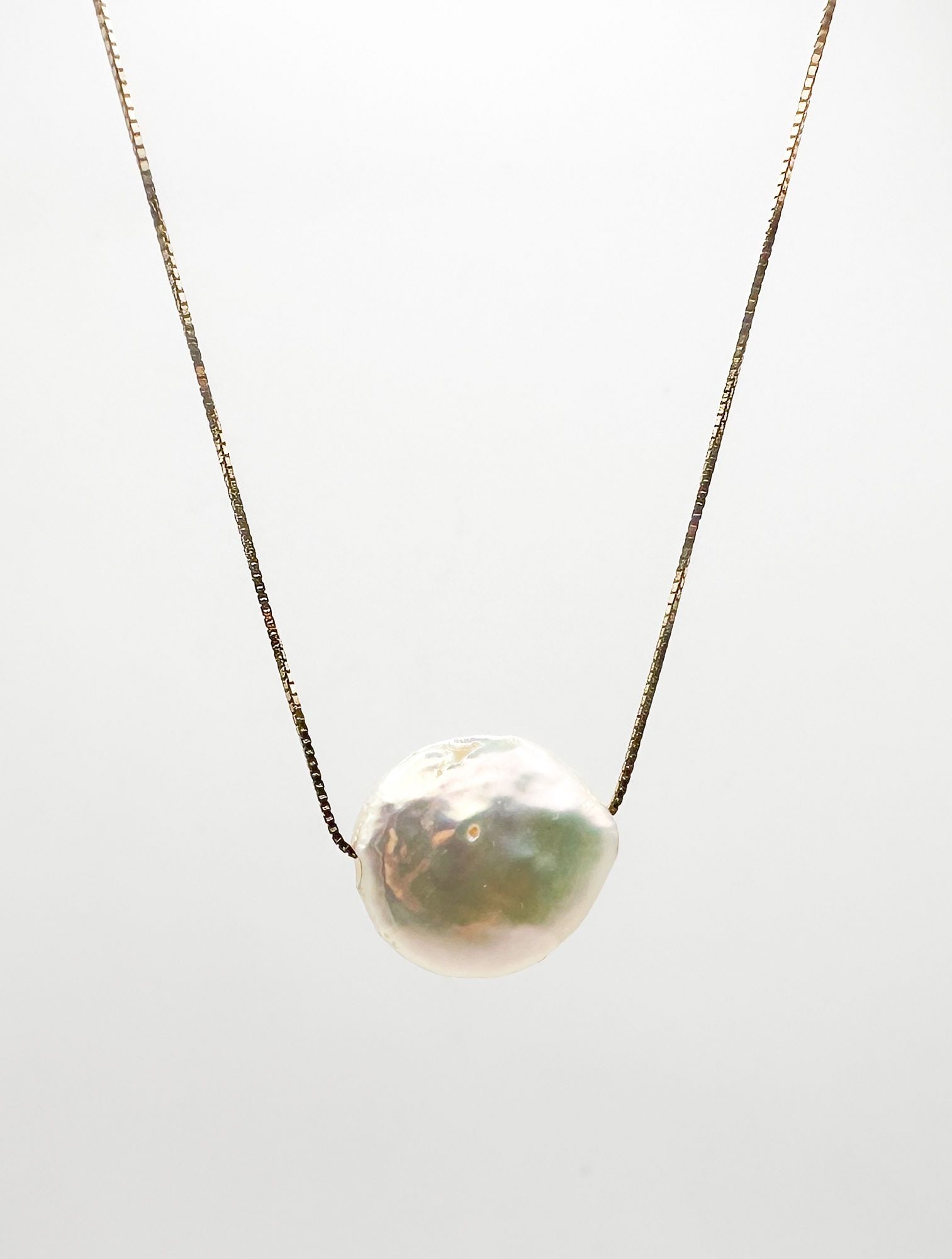 10K Gold Box Chain Pearl Pendant Necklace: 10K yellow gold box chain necklace featuring a baroque pearl pendant. Chain is 16 inches long, pearl is approximately 1/2 inch. Total weight: 2.2 grams.