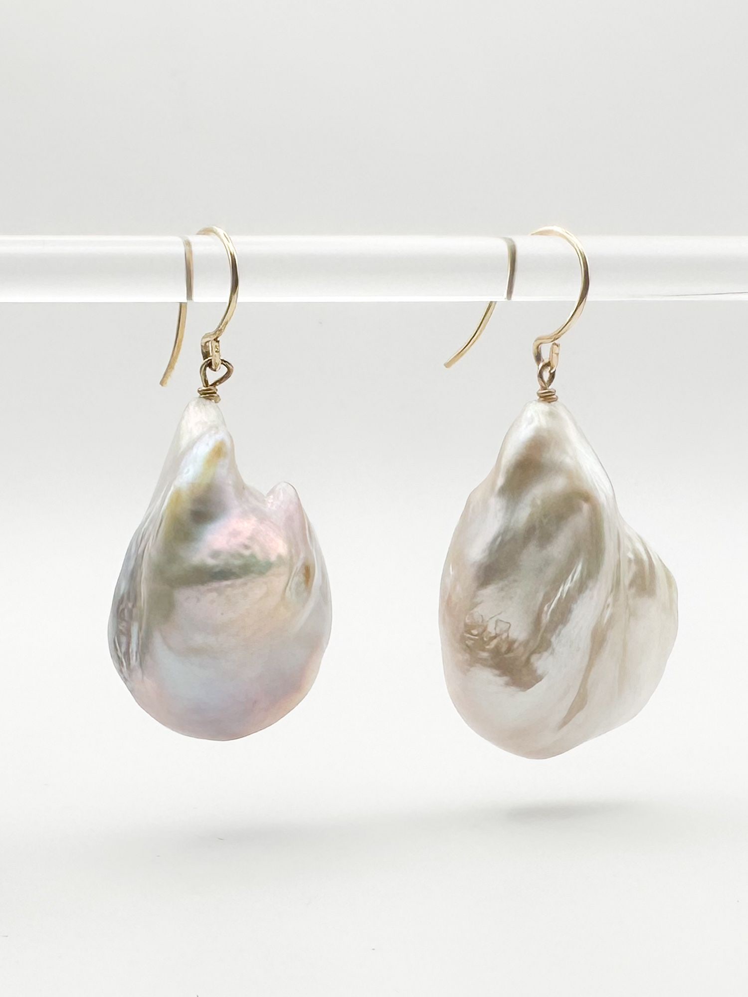 Baroque Pearl Earrings with 14K Gold: Pair of baroque pearl earrings with 14K gold fixtures. Pearls are approximately 1 1/4 inches long. Total weight: 16.6 grams.