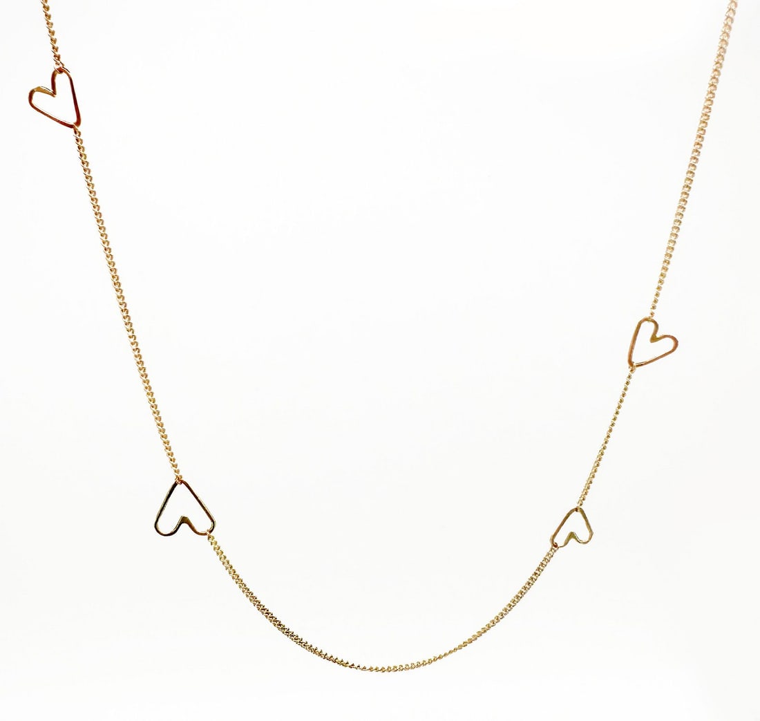 14K Yellow Gold Heart Link Necklace: 14K yellow gold necklace featuring open heart links connected by a fine chain. Measures approximately 16.25 inches in length and weighs 1.8 grams.