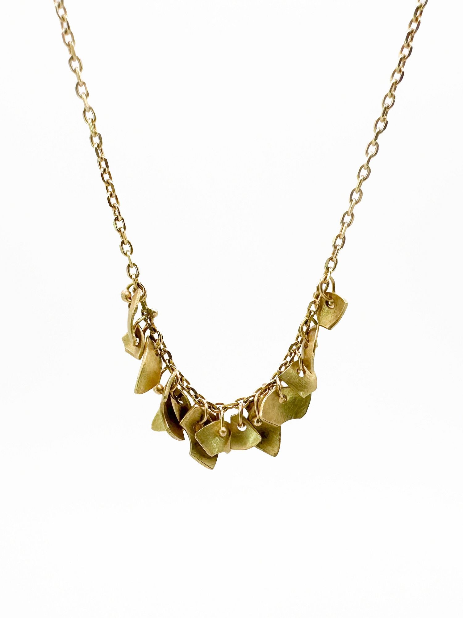 Sia Taylor 18K Yellow Gold 'Golden Meadow' Necklace: Sia Taylor 'Golden Meadow' necklace in 18K yellow gold. The necklace is 19 inches long and weighs 2.9 grams. Features delicate, leaf-shaped charms.