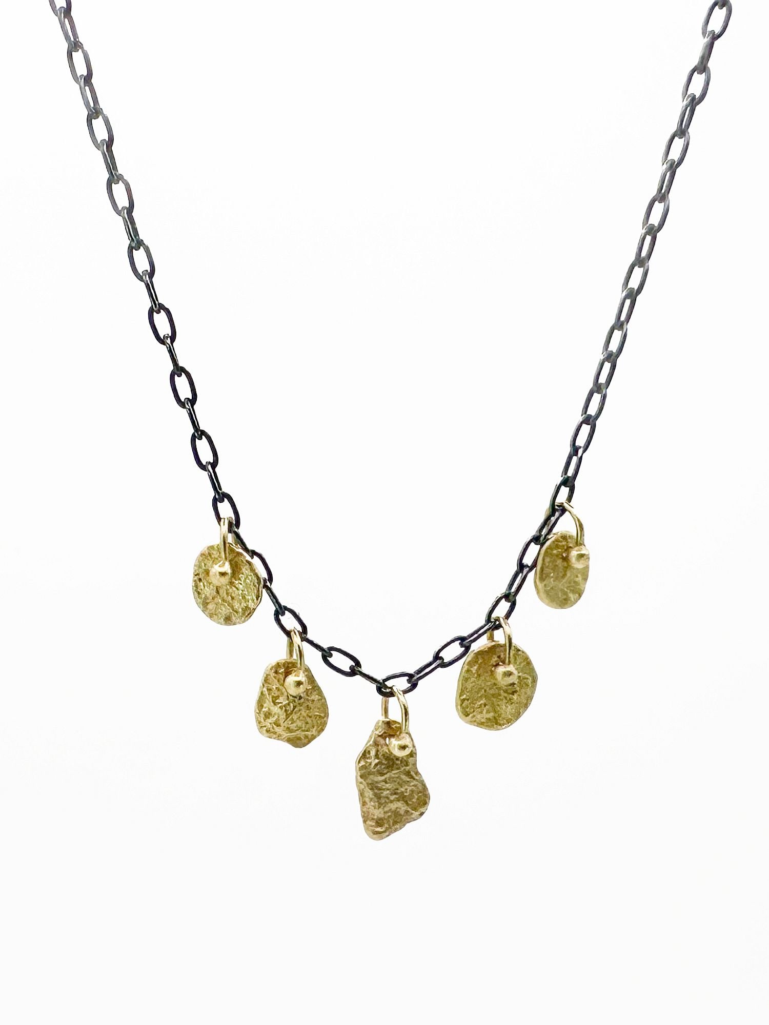 Sarah McGuire 18K Gold & Silver Waterline Necklace: Modern necklace by Sarah McGuire featuring a blackened sterling silver chain with five textured 18K yellow gold drops. The necklace is 16 inches long and offers a distinctive, casual style.