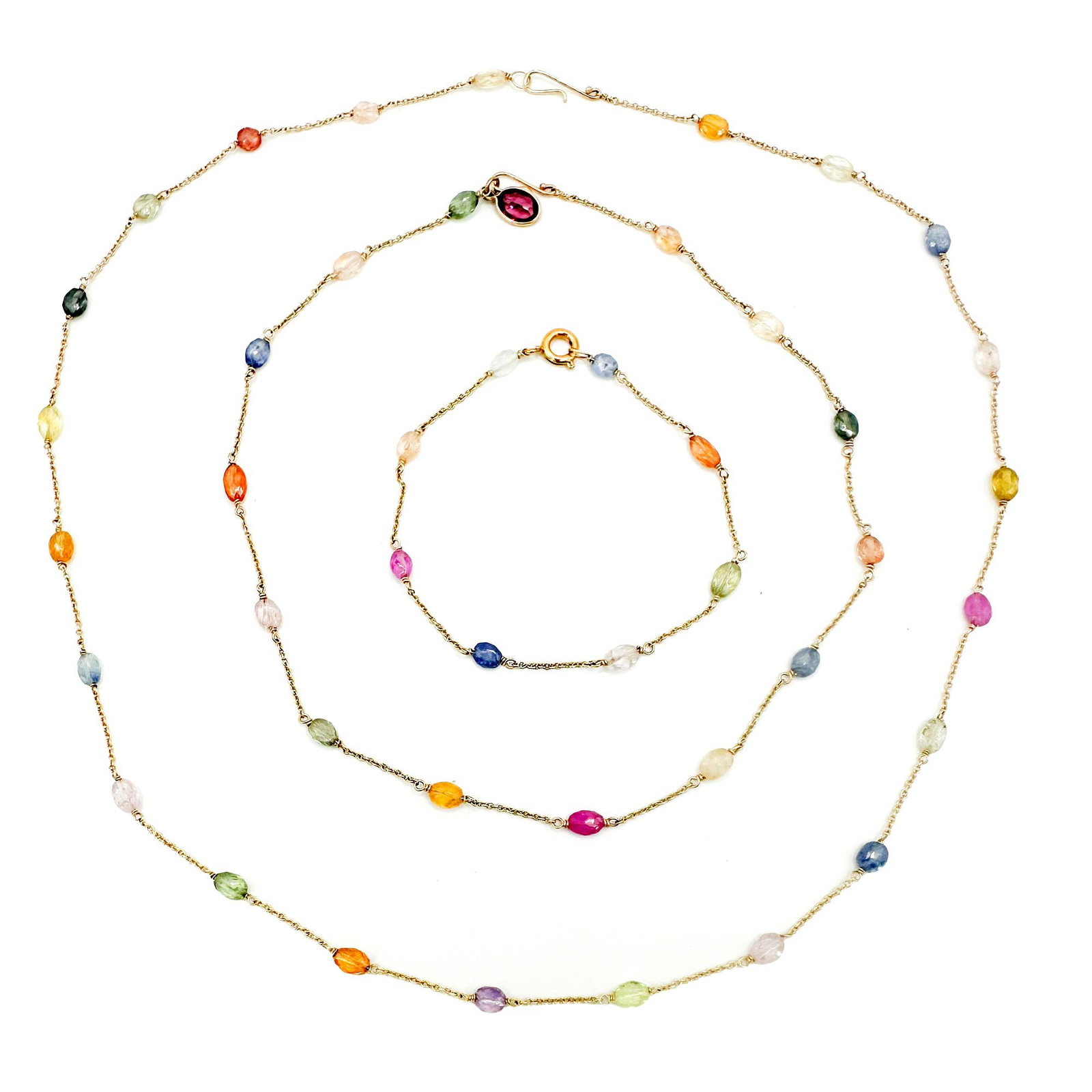 14K Gold Multi-Sapphire Bracelet, Choker & Necklace Set: A set of three 14K yellow gold jewelry pieces featuring multi-colored sapphires. Includes a 6.5-inch bracelet, a 14-inch choker, and a 19-inch necklace. Total weight is approximately 8 grams.