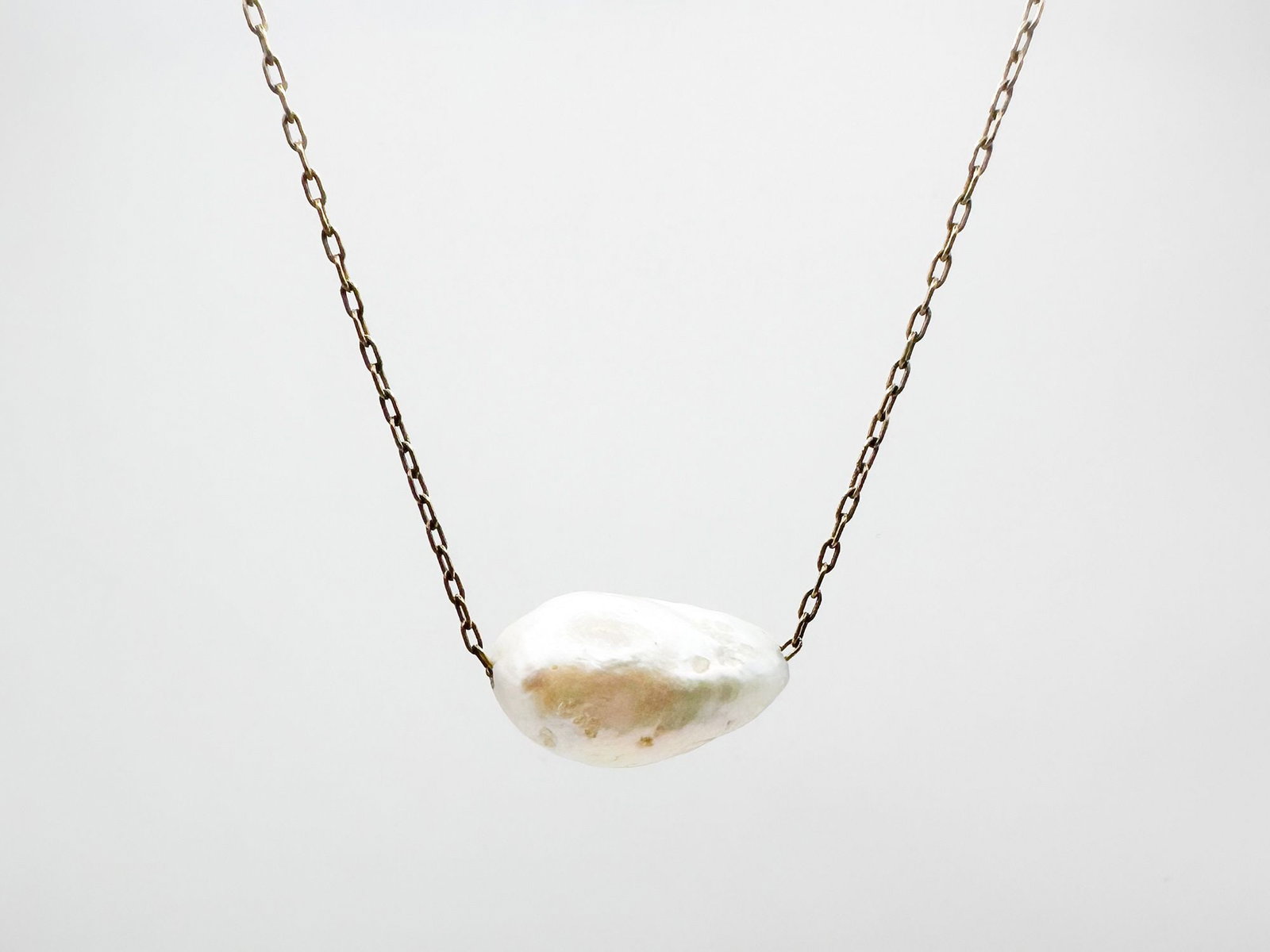 Ten Thousand Things 18K Gold and Solo Pearl Pendant Necklace: Ten Thousand Things 18K yellow gold necklace featuring a baroque pearl pendant. 16 inches long. 5.1 grams.