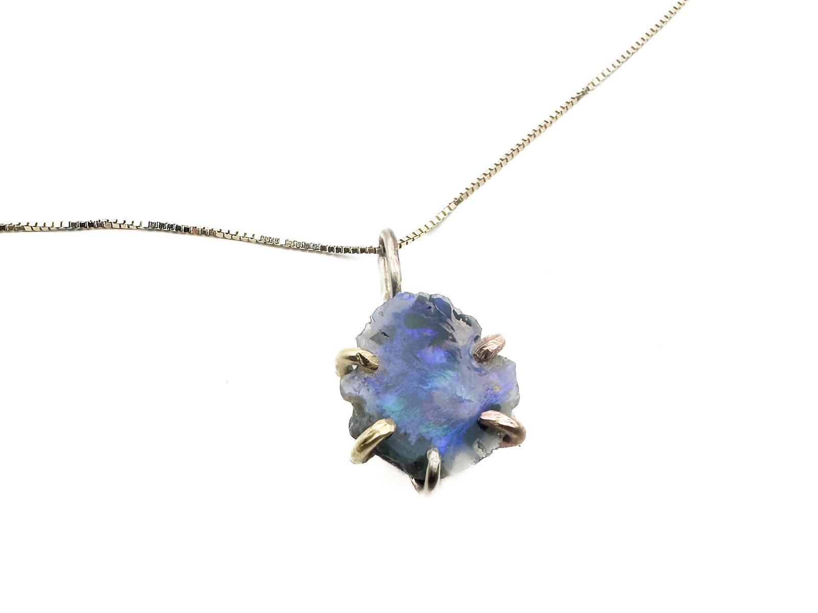 Variance 14K Gold Australian Opal Pendant Necklace: 14K gold pendant featuring a raw Australian opal. The pendant is suspended on a 16-inch chain. Pendant measures 5/8 inch long. Total weight: 1.8 grams.