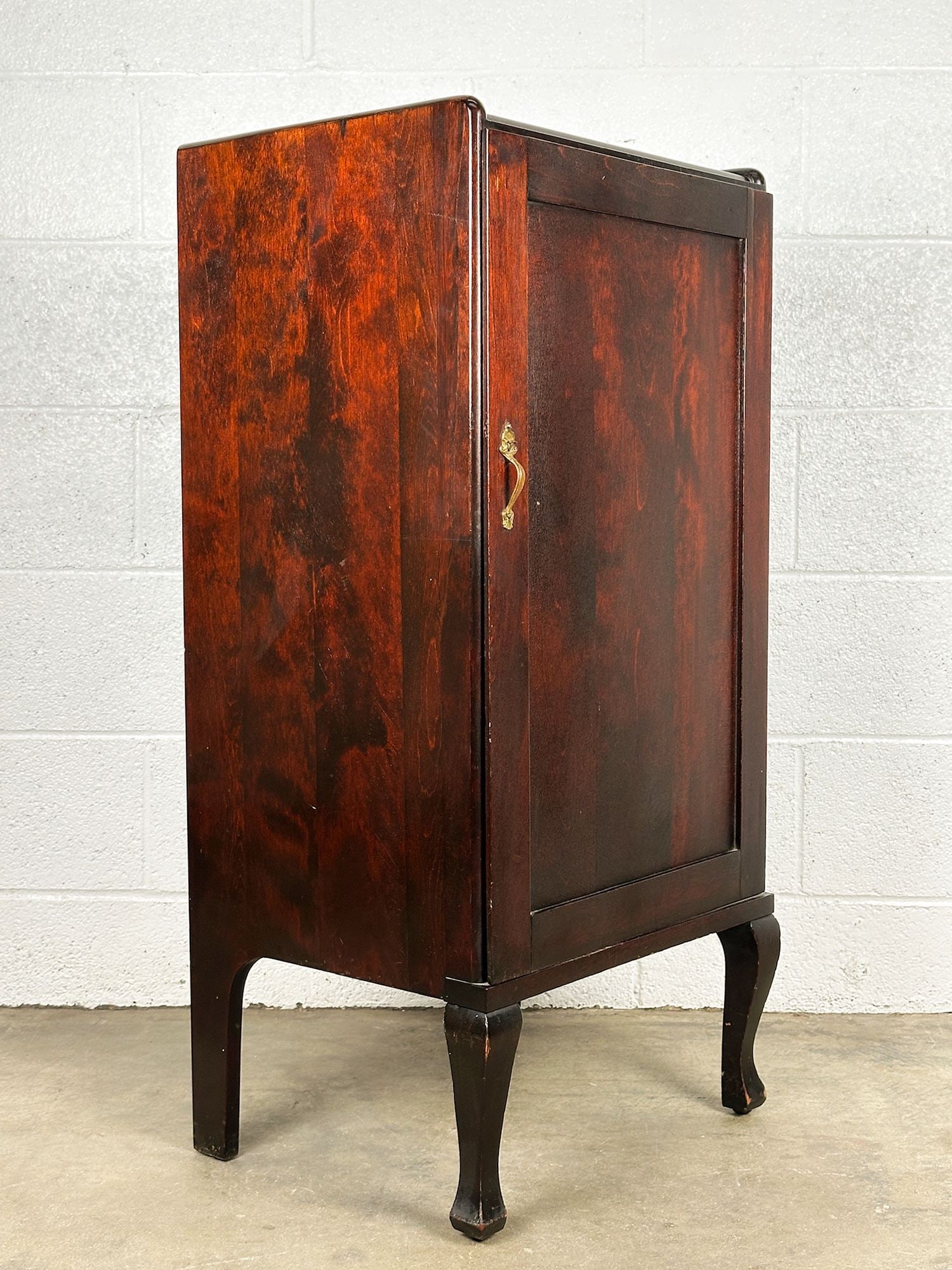 Antique Wooden Cabinet for Player Piano Rolls: Cabinet features one hinged door with three shelves within; two leaves are adjustable for the shelving. Metal hardware handle. Approximately 38.5 in H x 18.5 in W x 14.75 in D. LOCAL PICK UP INFORMATI
