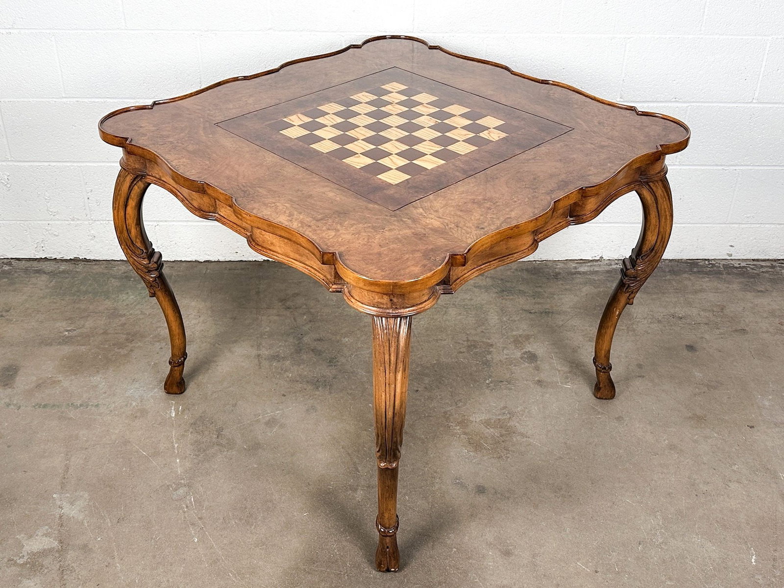 Vintage Burl Wood Top Chess & Backgammon Game Table with Cloven Hoof Feet: Carved wood on legs with cloven hoof feet. Chess table top panel is removable and reveals backgammon board. Panel is reversible and can be flipped to show cohesive burl wood table top. Dimensions: Tab