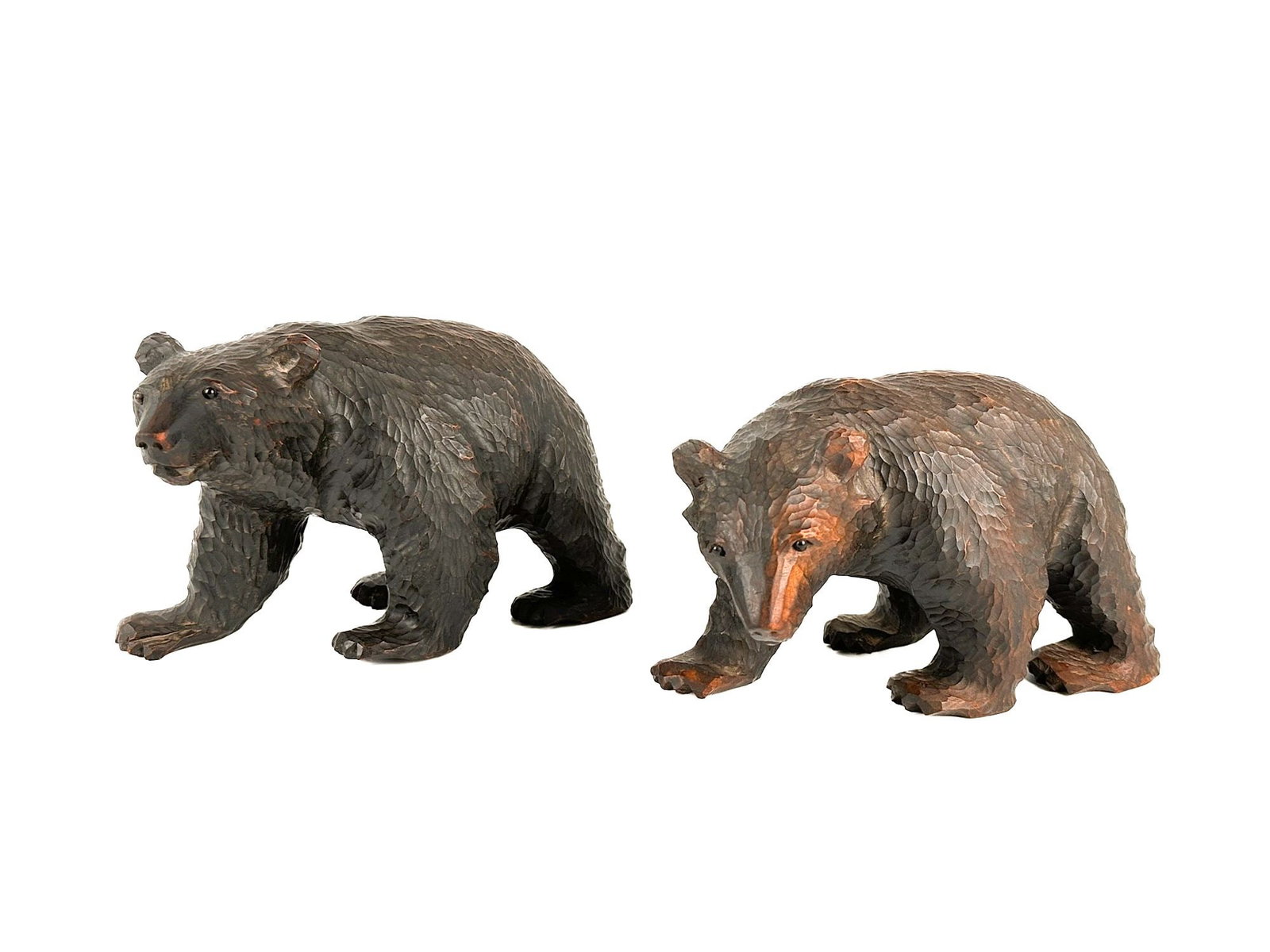 Lot of 2 Vintage Black Forest Hand-Carved Wood Bears: Lot includes two hand carved bears with intricate fur details. Each bear is approximately 5.75 in H x 9 in W x 4.25 in D. Total weight is approximately 2 lbs 13 oz. LOCAL PICK UP INFORMATION: Wednesda