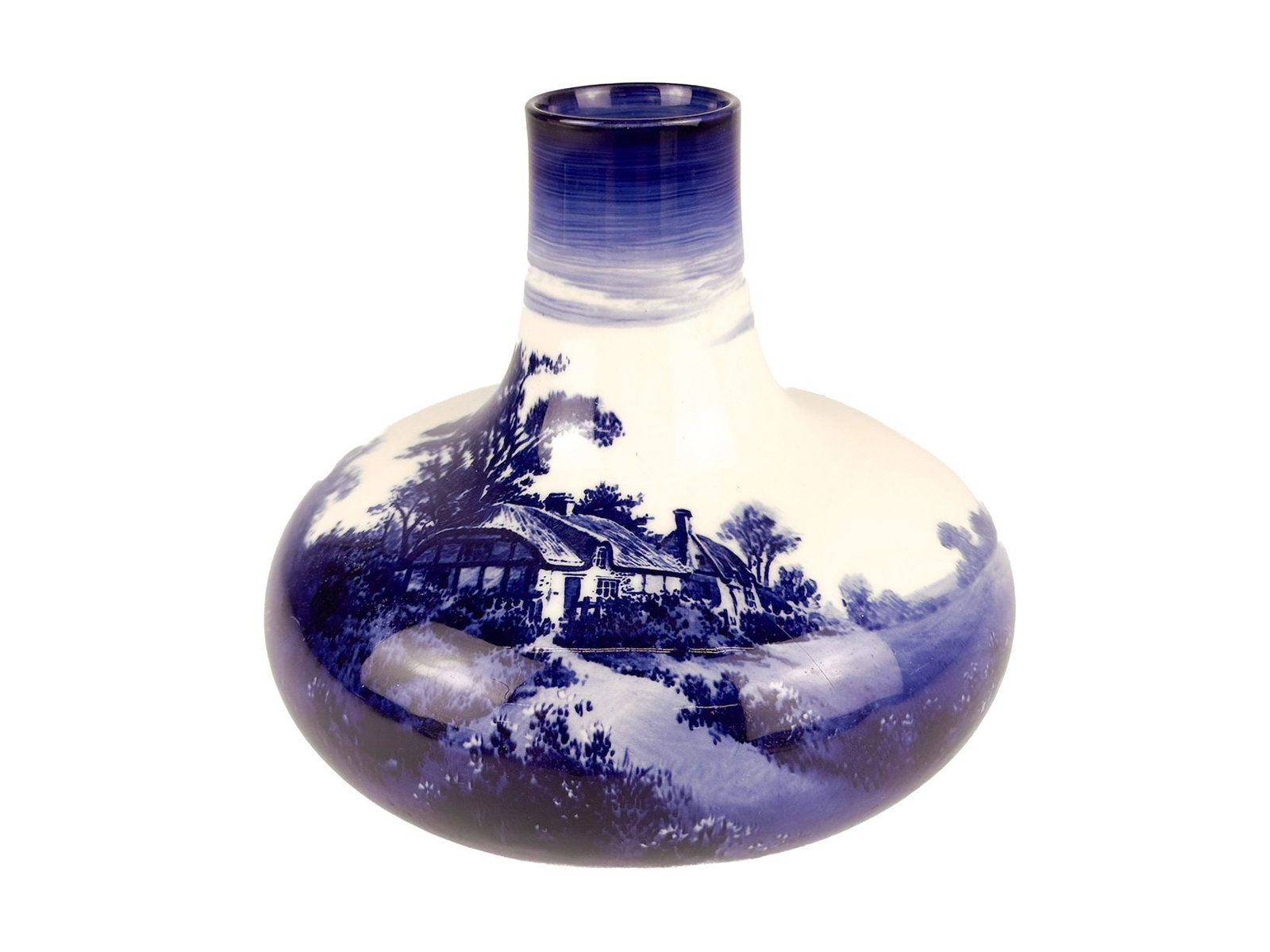Antique Royal Doulton Blue and White Porcelain Vase: Vase is stamped on the bottom and has a serial number of 7188. Depicts a painting of a cottage in the countryside in cobalt blue. Approximately 6.75 in H x 8 in W x 8 in D. Weighs approximately 2 lbs 