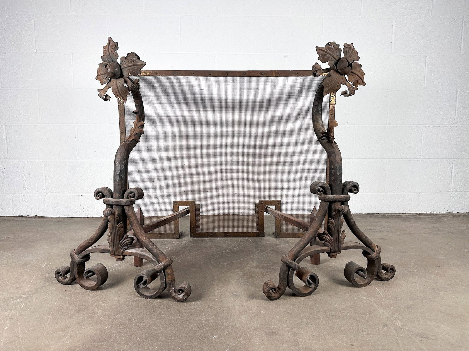 Wrought Iron Floral Motif Fireplace Andirons and Screen: 3 pc aniron and screen. Floral wrought iron detail. Aniron is approx. 35.5 in H x 51 in W x 32 in D. Weighs 91 lbs. LOCAL PICK UP INFORMATION: Wednesday, July 8, 10:00 AM - 2:00 PM 8059 Foothill Blvd,