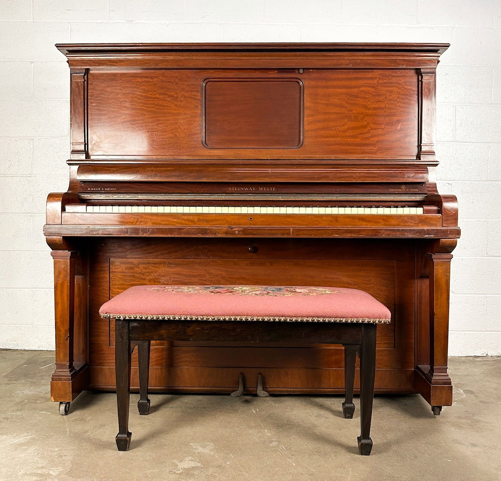 Steinway Welte Upright Player Piano w/ Bench, Mahogany, Ser. 226139, c. 1924: A Steinway-Welte reproducing upright piano in figured mahogany, serial no. 226139 (circa 1924), the fallboard inscribed M. Welte & Soehne / Steinway-Welte / Steinway & Sons and fitted with the