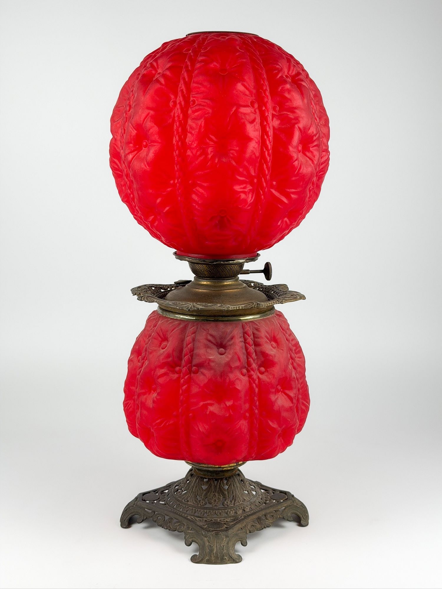 Antique Pittsburgh Brass and Glass Company Red Satin Glass Oil Lamp: Made of red satin glass with pressed embellishments. Brass base and hardware. Approximately 24.5 in H x 10 in W x 10 in D. Weighs approximately 11 lbs 10 oz. LOCAL PICK UP INFORMATION: Wednesday, July