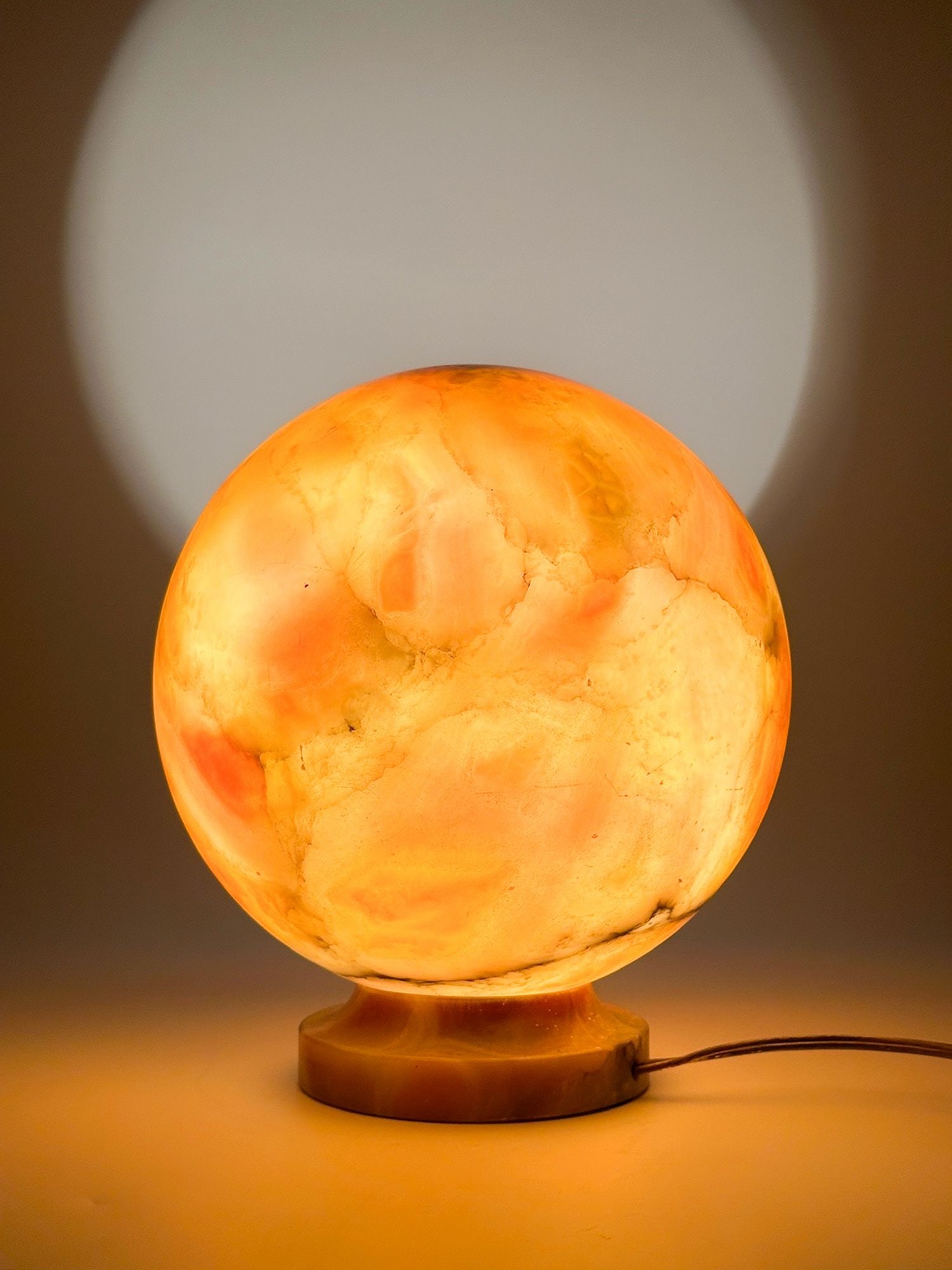Carved Art Deco Alabaster Globe Lamp: Ball shaped lamp features marbleized stone alabaster. Approximately 9.75 in H x 8 in W x 8 in D. Weighs approximately 11 lbs 6 oz. LOCAL PICK UP INFORMATION: Wednesday, July 8, 10:00 AM - 2:00 PM 8059