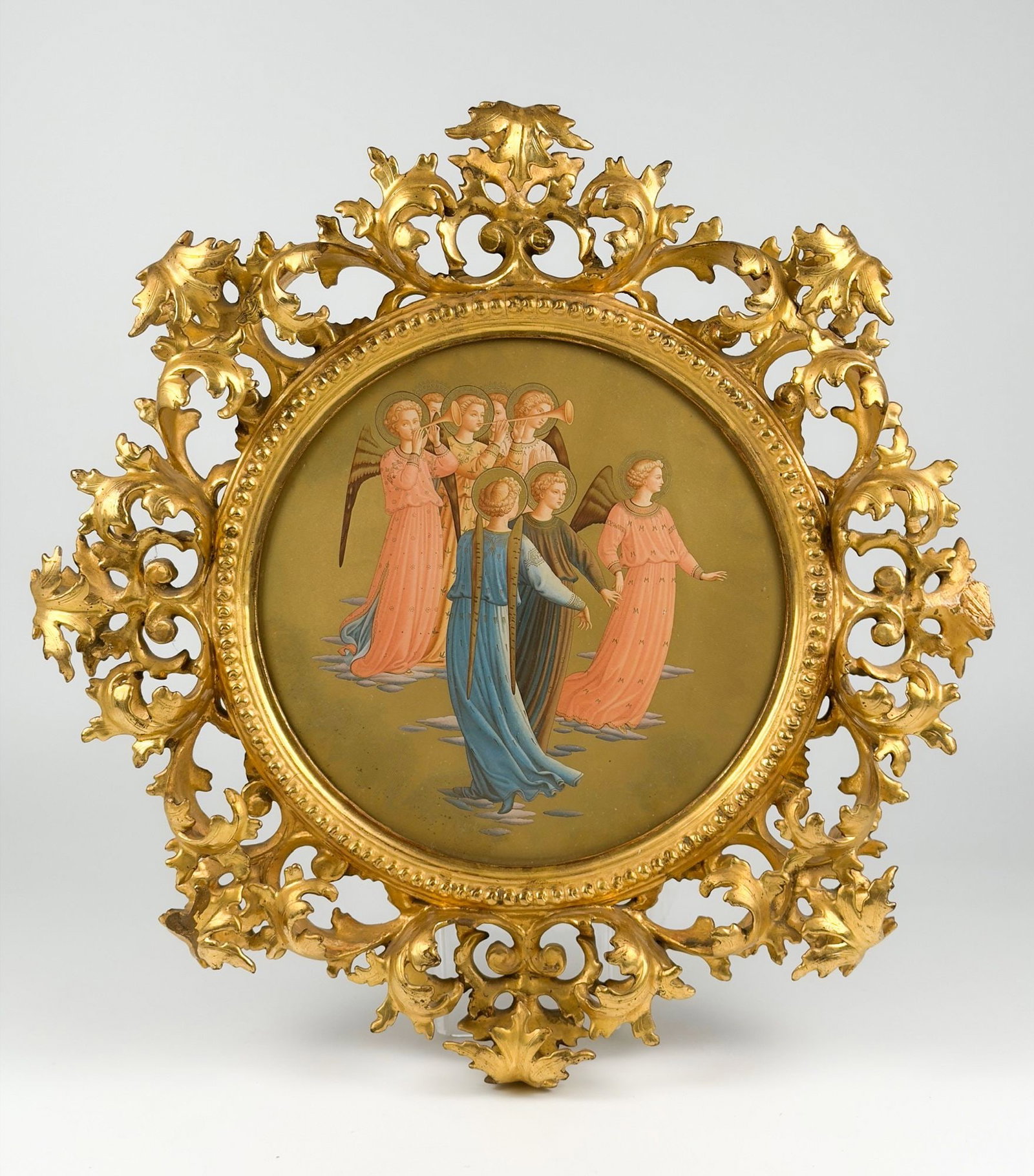 Antique Fra Angelico Print, The Coronation of the Virgin Devotional Framed Print: Titled The Coronation Of The Virgin. Circular print depicts eight angels with gold leaf embellishments. Ornate gold leaf frame. Visible image is approximately10.25 in H x 10.25 in D. Frame is approxim