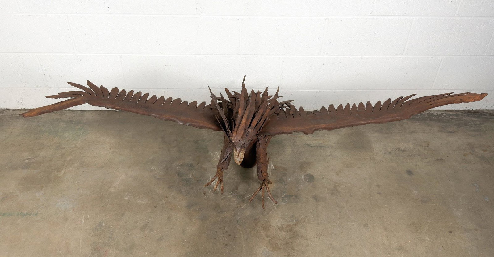 Americana Folk Art Torch-Cut Steel Eagle Sculpture on Pipe Mount: Large sculpture comprised of cut pieces of metal. Mounts to wall. Claws are made from rebar. Includes mounting hardware. Dimensions: Sculpture is approx. 19 in H x 74 in W x 26 in D. Weighs 58 lbs. LO