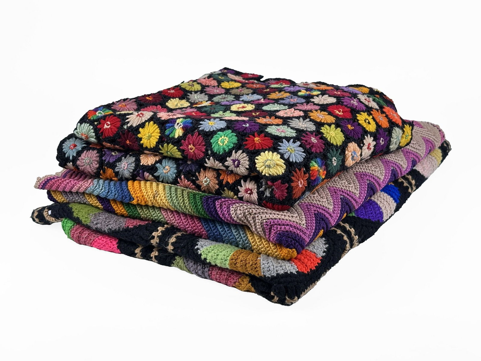 Three Hand-Crocheted Blankets: Floral, Chevron, and Circular Motif: Dimensions: Blankets are approx. striped: 64.5 in W x 45 in L, floral: 64.5 in W x 63 in L and rainbow wheels: 68 in W x 48 in L. Weighs 10 lbs 9 oz. LOCAL PICK UP INFORMATION: Wednesday, July 8, 10:0