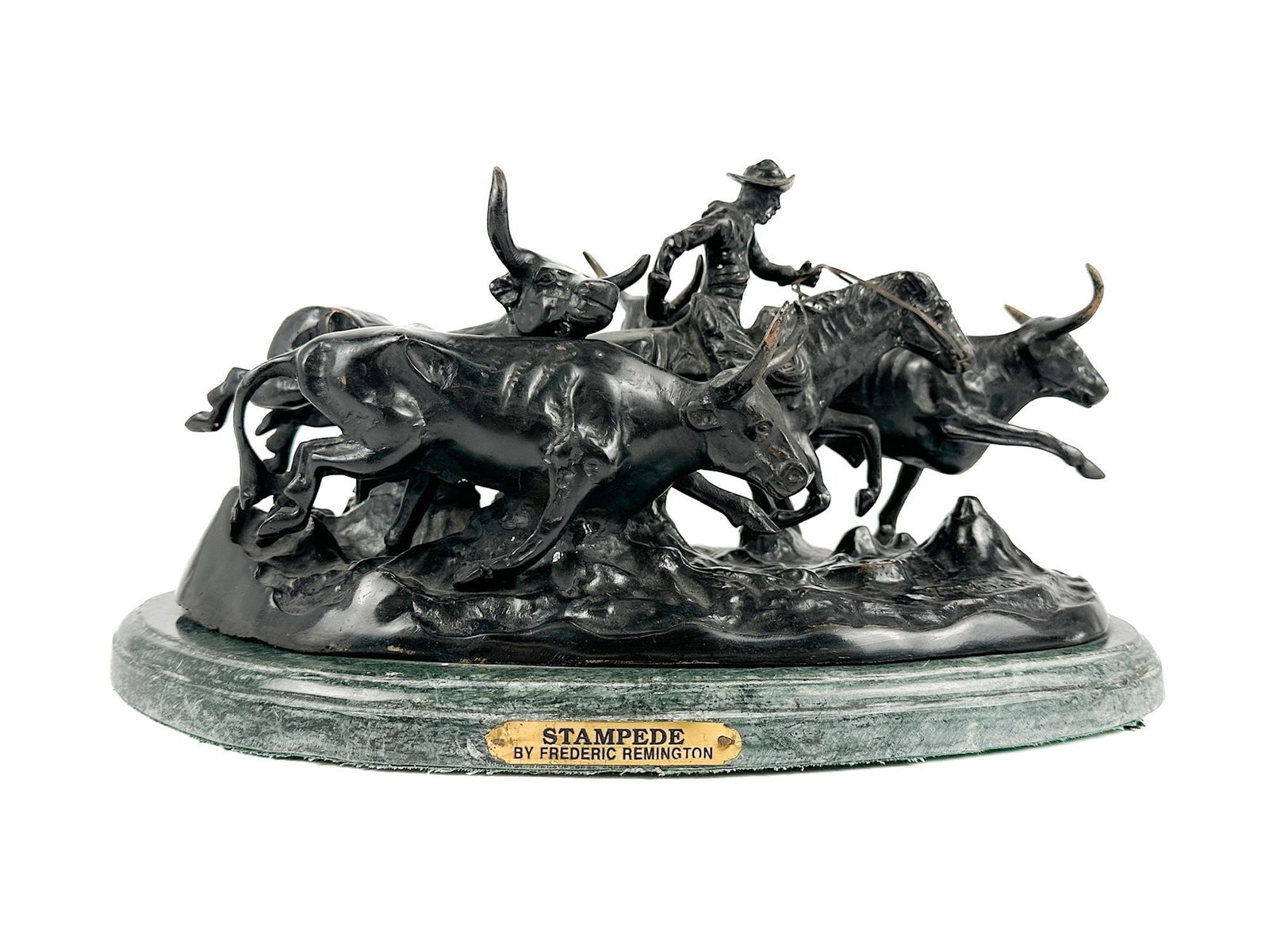 After Frederic Remington, Stampede, Cast Bronze Sculpture, Late 20th Century: Patinated cast bronze group depicting a mounted cowboy driving a stampeding herd of longhorn cattle, on a green marble base with applied brass title plaque inscribed "STAMPEDE BY FREDERIC REMINGTON."&