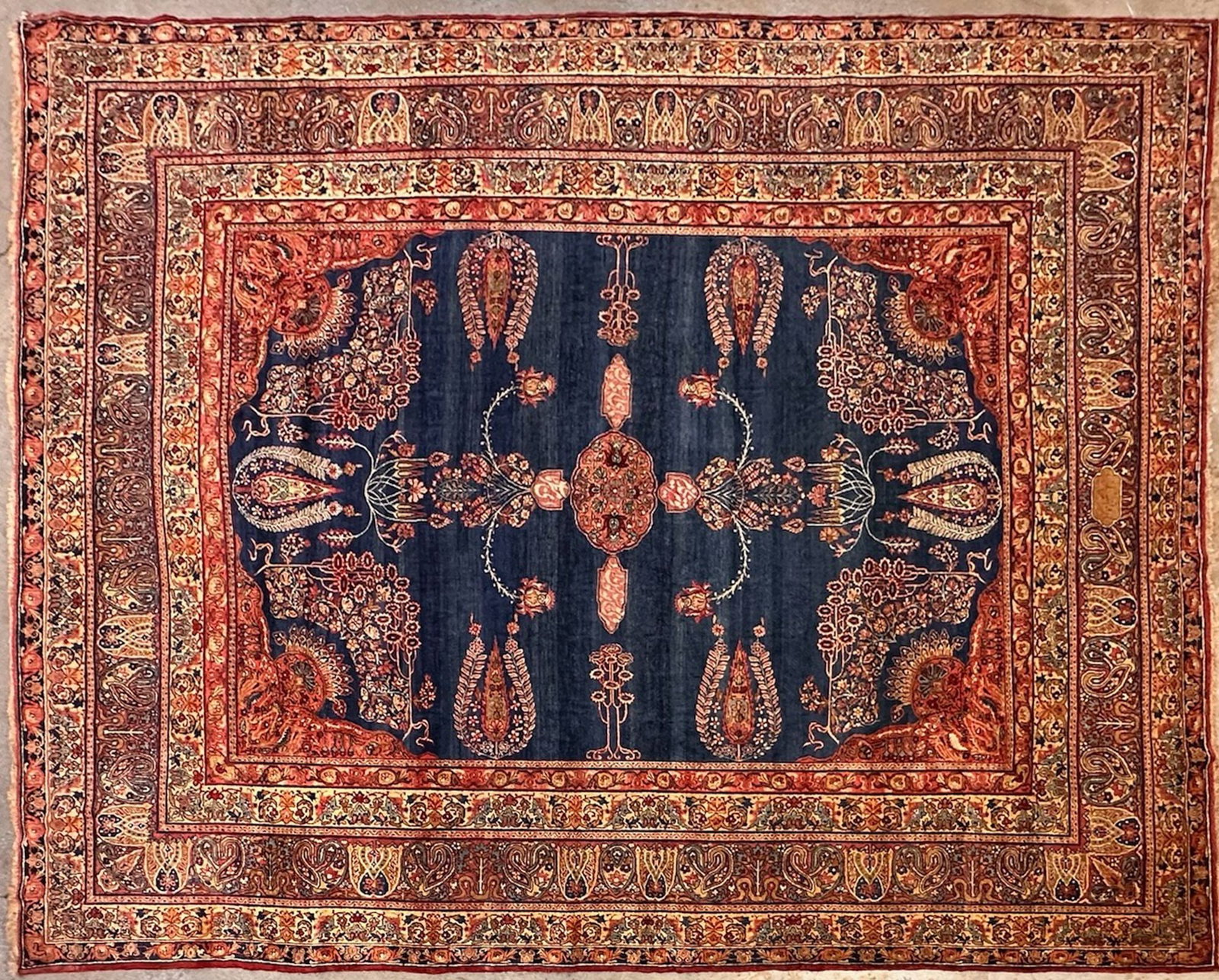 Antique Kerman Hand-knotted Wool Rug, Circa 1900, 11'9" x 8'9": An antique hand-knotted wool rug from Kerman, Iran, circa 1900. Features a deep blue field with intricate red and gold traditional motifs, including paisley elements. Dimensions: 11'9" x 8'9" (approx.