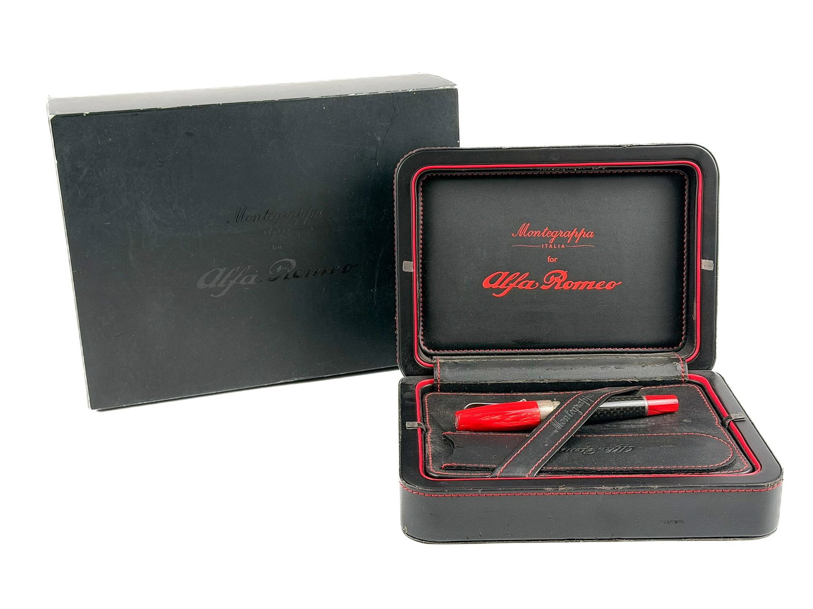 Montegrappa for Alfa Romeo Limited Edition Fountain Pen with Presentation Case: A Montegrappa for Alfa Romeo limited edition pen and presentation case. The pen features a red barrel with carbon fiber accents and sterling silver trim. Nib is 14k gold. Approx. dimensions: 5.25 in L