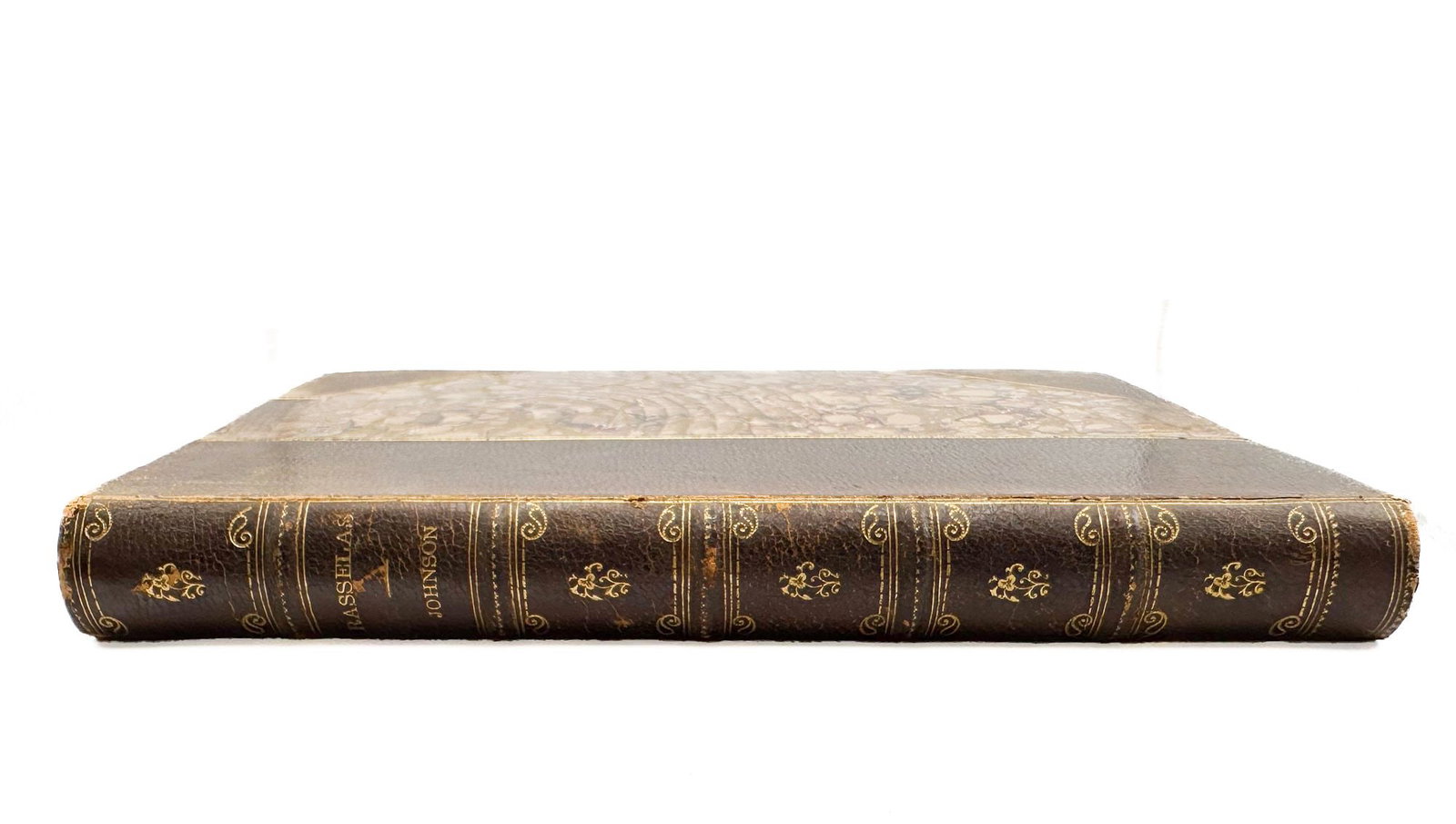 Samuel Johnson, LL.D. Rasselas, Prince of Abyssinia. New American Edition. Chicago: A. C. McClurg,: McClurg 'Laurel Crowned Tales' edition in dark pebbled leather with gilt-tooled spine and marbled boards, bearing a Christmas 1898 presentation inscription from 'Her Cousits' to 'Bessie Drummond.' The