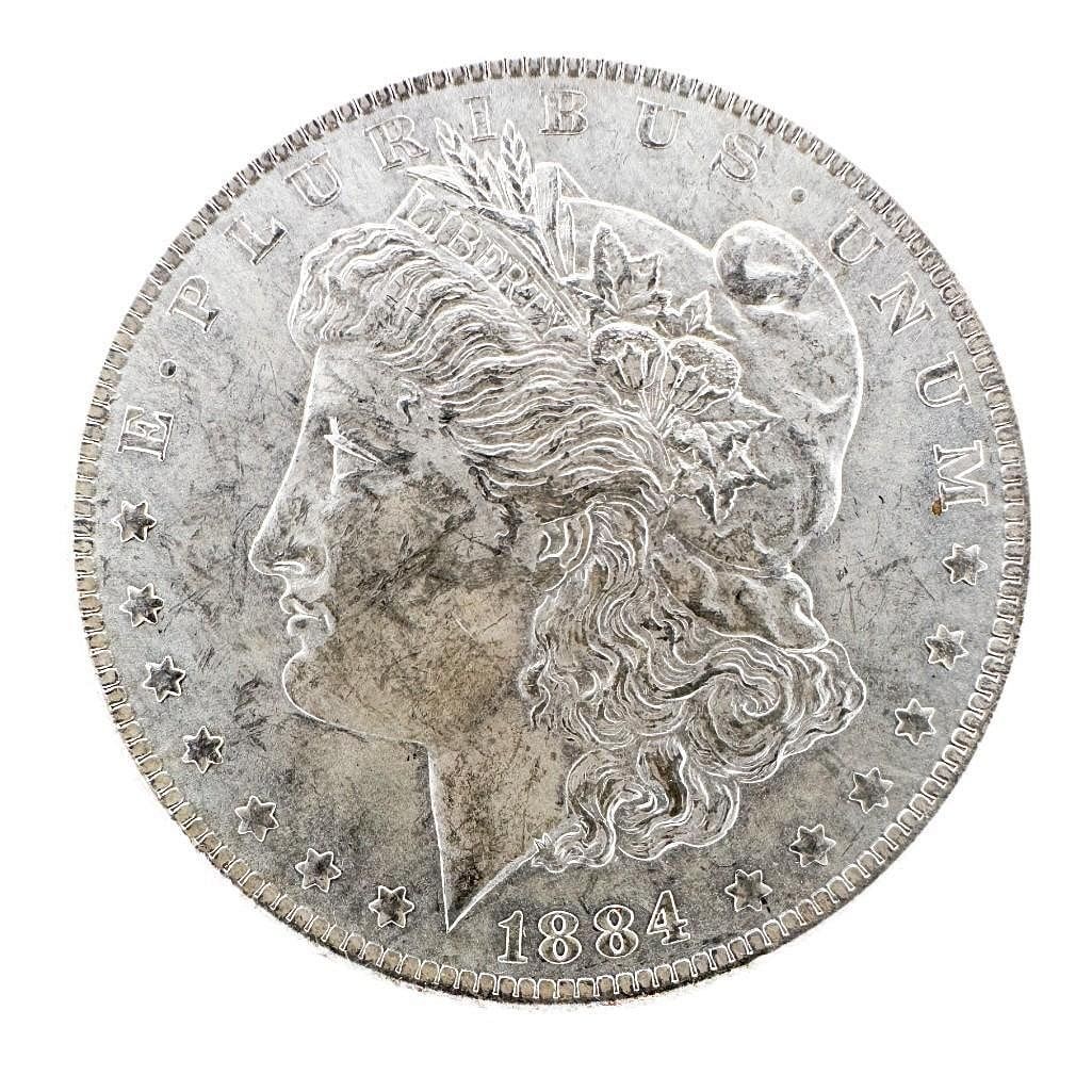 1884-O Morgan Dollar: An 1884-O Morgan dollar from the New Orleans Mint. A circulated common-date example. Shipping & Handling. All lots won by the same bidder are combined into one shipment via USPS Priority Mail (trackin