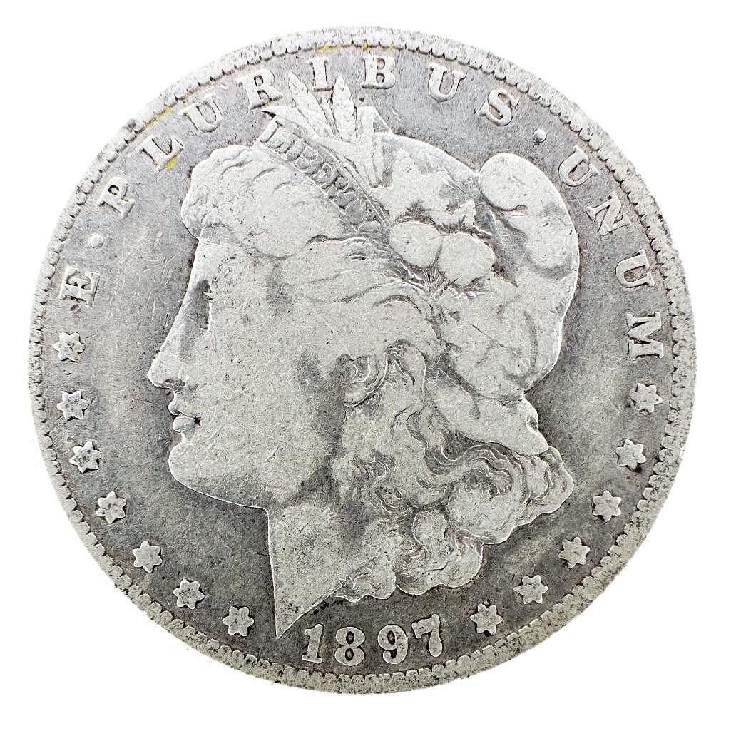 1897-O Morgan Silver Dollar: An 1897-O Morgan dollar from the New Orleans Mint. A better-date issue within the series. Shipping & Handling. All lots won by the same bidder are combined into one shipment via USPS Priority Mail (tr