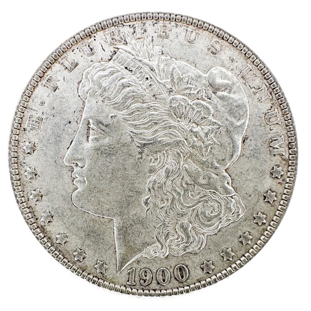 1900 Morgan Silver Dollar: A 1900 Morgan dollar, a circulated late-series example. Features Liberty and a heraldic eagle. Shipping & Handling. All lots won by the same bidder are combined into one shipment via USPS Priority Mai