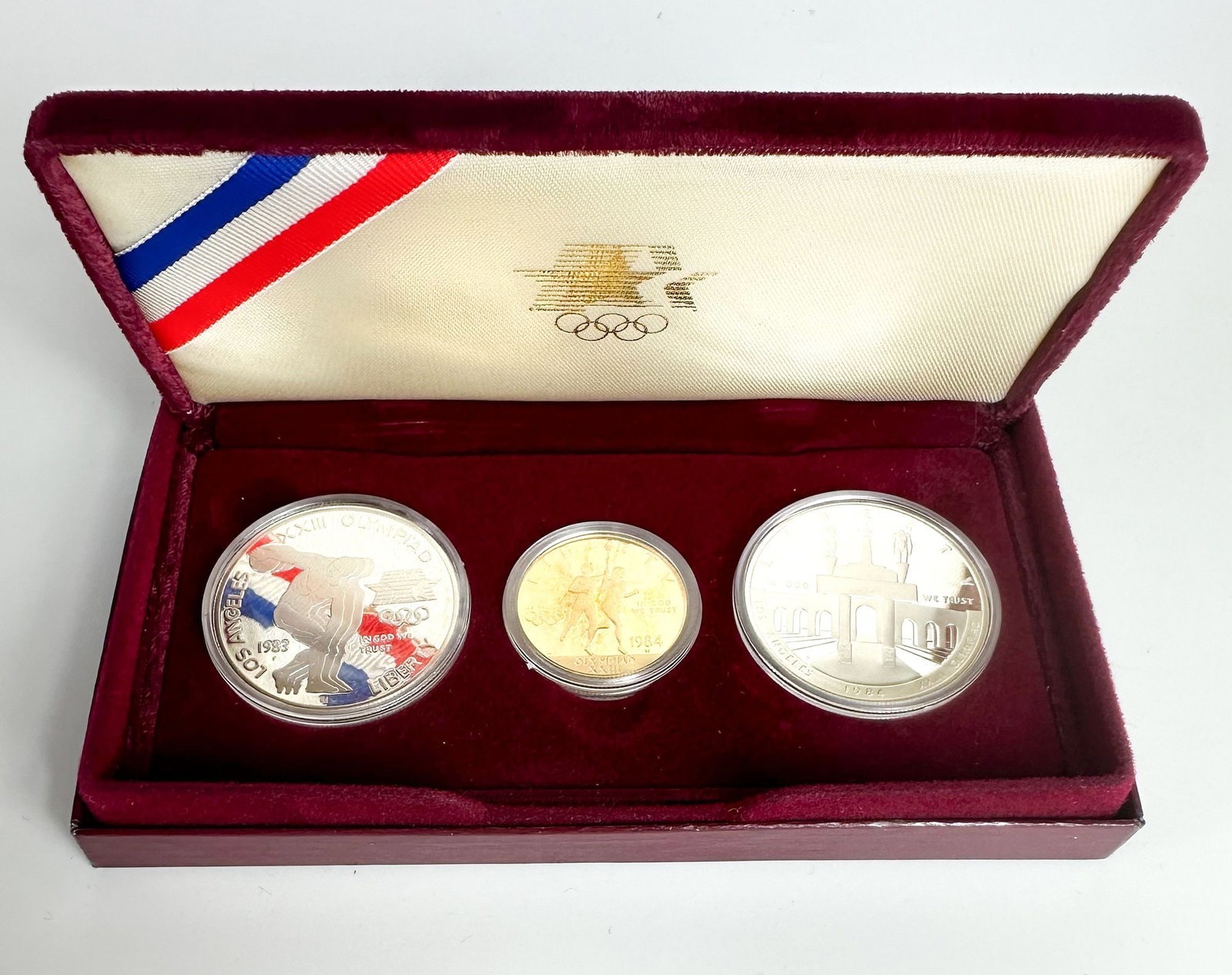 1984 LA Olympics Three-Coin Proof Set with $10 Gold: A 1984 Los Angeles Olympics three-coin proof set with the $10 commemorative and two dollars. A flagship U.S. Olympic commemorative. Shipping & Handling. All lots won by the same bidder are combined in