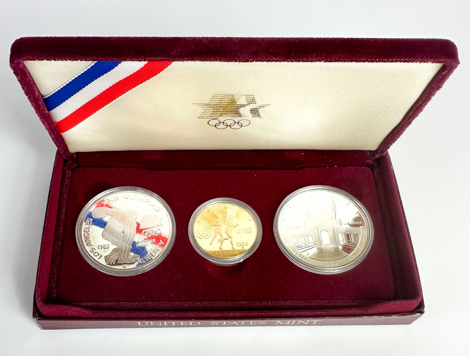 1984 LA Olympics Three-Coin Proof Set with $10 Gold: A 1984 Los Angeles Olympics three-coin proof set including the $10 commemorative. Issued for the 1984 Los Angeles Games. Shipping & Handling. All lots won by the same bidder are combined into one ship