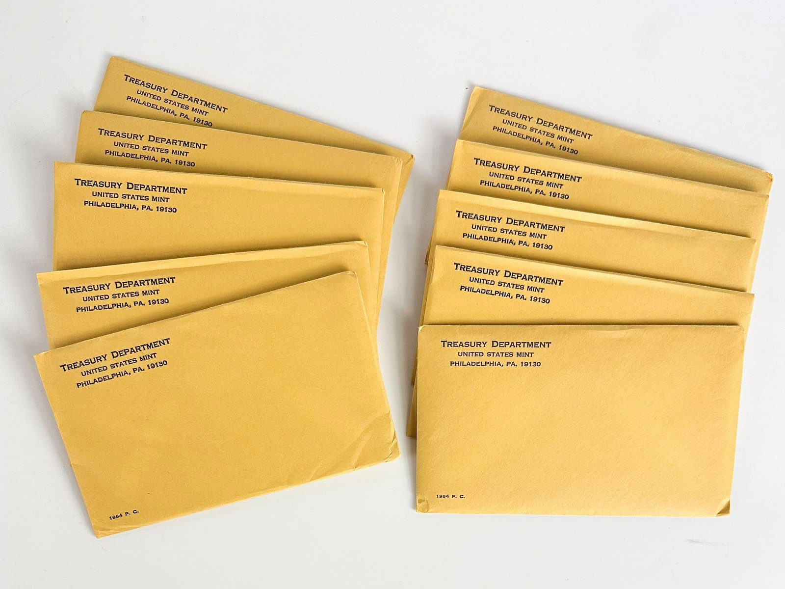 Lot of 10 1964 US Mint Proof Sets, Philadelphia (Sealed): Ten 1964 U.S. proof sets in sealed Philadelphia envelopes. Original mint-sealed packaging. Shipping & Handling. All lots won by the same bidder are combined into one shipment via USPS Priority Mail (t