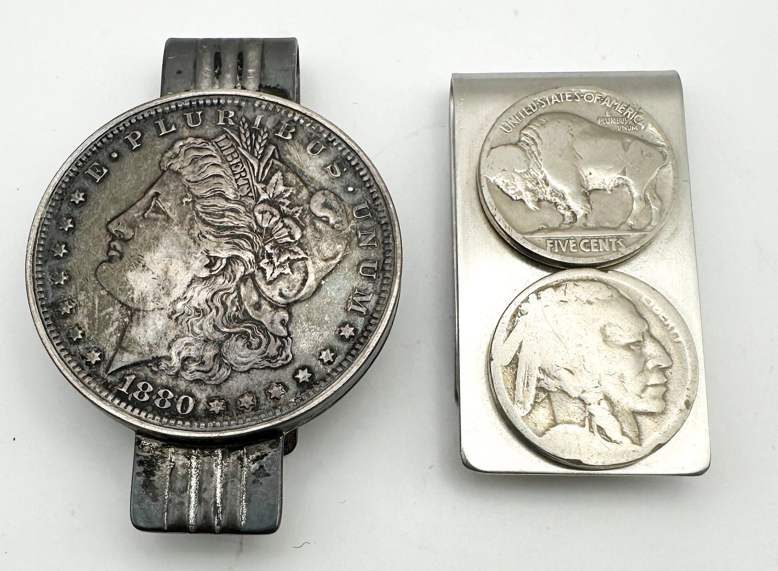 Lot of 2 US Coin Money Clips with Morgan Dollar & Buffalo Nickels: Two money clips, one mounting a Morgan dollar and the other Buffalo nickels. Novelty pieces made from U.S. coins. Shipping & Handling. All lots won by the same bidder are combined into one shipment vi