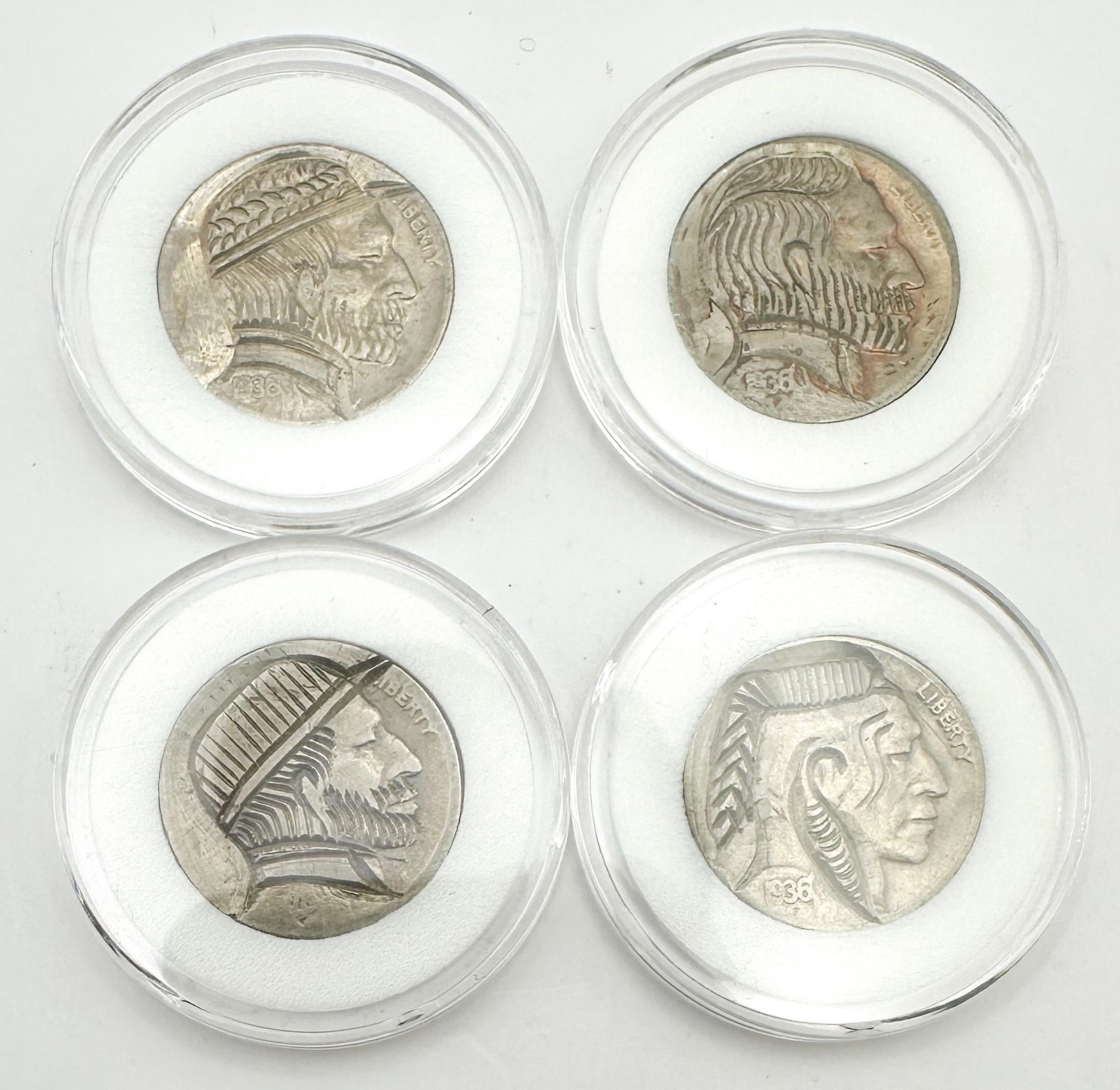 Lot of 4 Hobo Nickels in Holders: Four hand-carved hobo nickels in holders, carved from Buffalo nickels. Folk-art engravings prized for their craftsmanship. Shipping & Handling. All lots won by the same bidder are combined into one sh