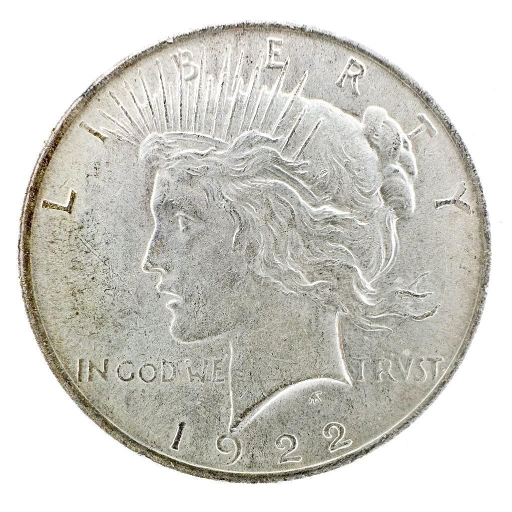 1922 Peace Dollar: A 1922 Peace dollar from the first standard-relief year. A circulated common-date example. Shipping & Handling. All lots won by the same bidder are combined into one shipment via USPS Priority Mail