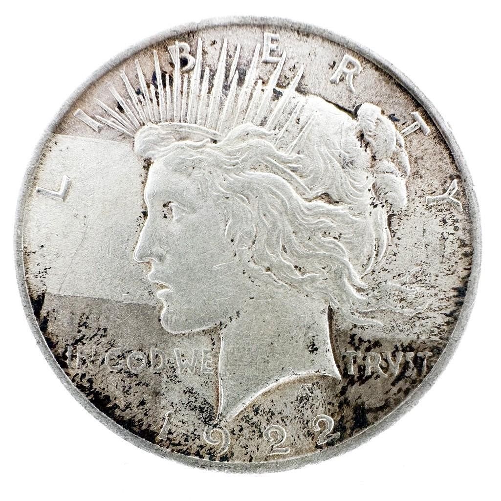 1922 Peace Dollar: A 1922 Peace dollar featuring Liberty and a perched eagle. A common date of the series. Shipping & Handling. All lots won by the same bidder are combined into one shipment via USPS Priority Mail (trac