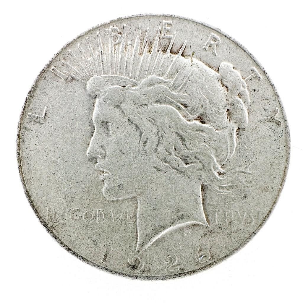 1926 Peace Dollar: A 1926 Peace dollar. A circulated mid-series example. Shipping & Handling. All lots won by the same bidder are combined into one shipment via USPS Priority Mail (tracking included). Flat rate by packa