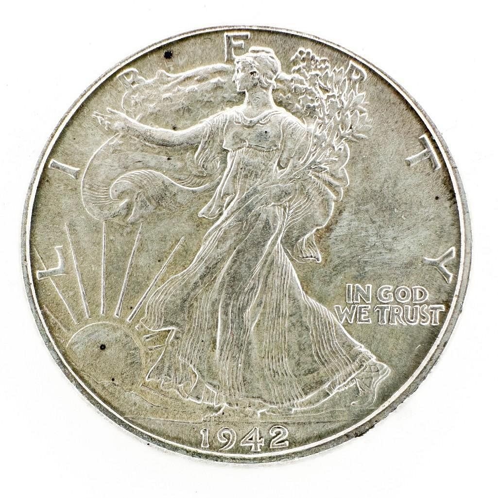 1942 Walking Liberty Half Dollar: A 1942 Walking Liberty half dollar. A common late-series Philadelphia issue. Shipping & Handling. All lots won by the same bidder are combined into one shipment via USPS Priority Mail (tracking includ