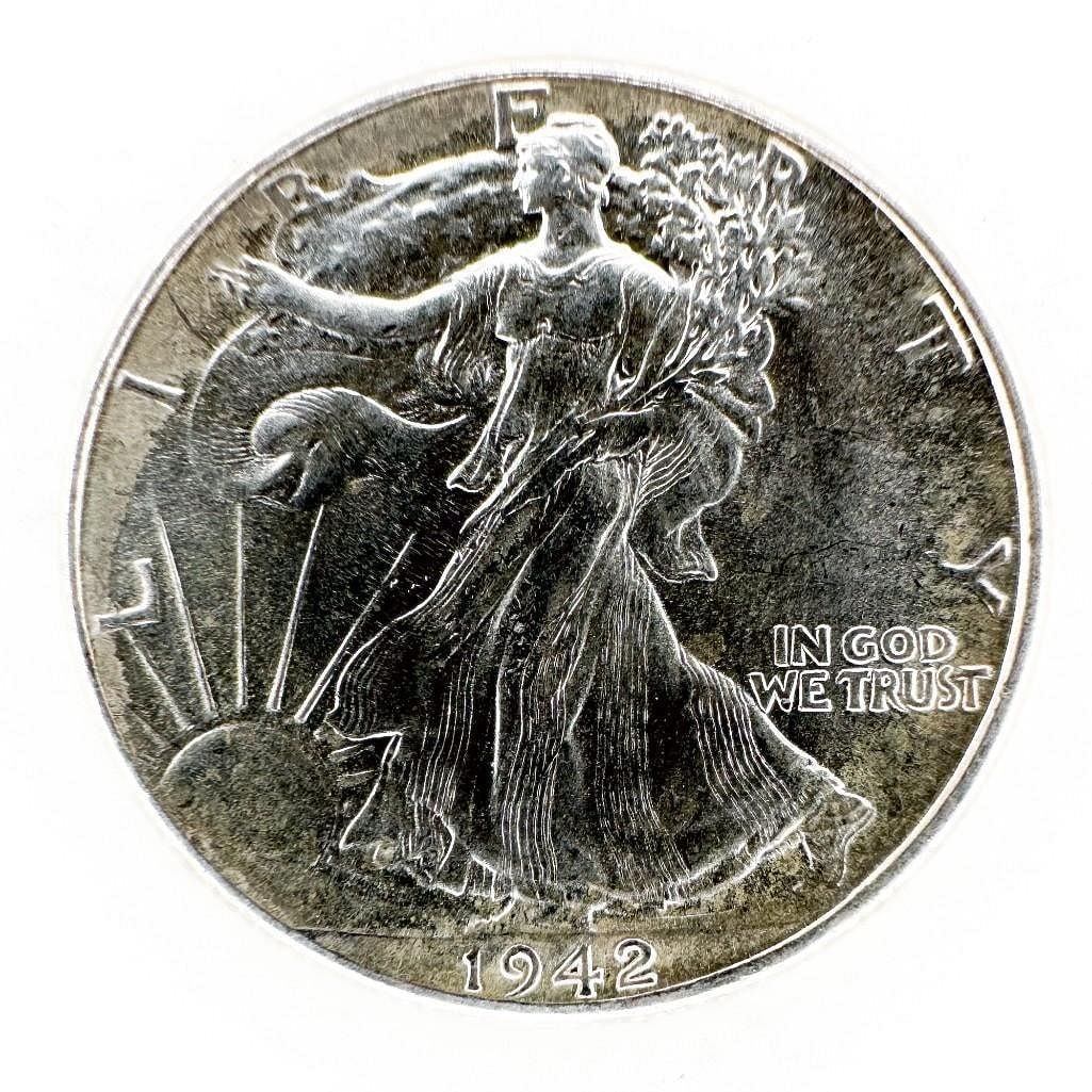 1942 Walking Liberty Half Dollar: A 1942 Walking Liberty half dollar. A circulated wartime example. Shipping & Handling. All lots won by the same bidder are combined into one shipment via USPS Priority Mail (tracking included). Flat r
