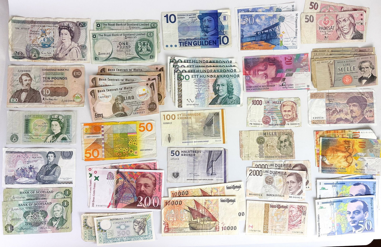 Large Group of European Banknotes, Mid-20th Century to c. 2000: A large group of pre-euro and obsolete European national banknotes. Spans the British Isles, Scandinavia, France, Italy, Iberia and more. Shipping & Handling. All lots won by the same bidde