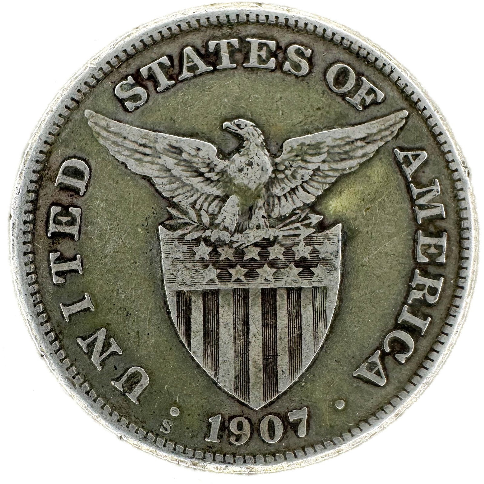 1907-S Philippines One Peso: A 1907-S Philippines one peso. A large circulated peso of the period. Shipping & Handling. All lots won by the same bidder are combined into one shipment via USPS Priority Mail (tracking included). Fl