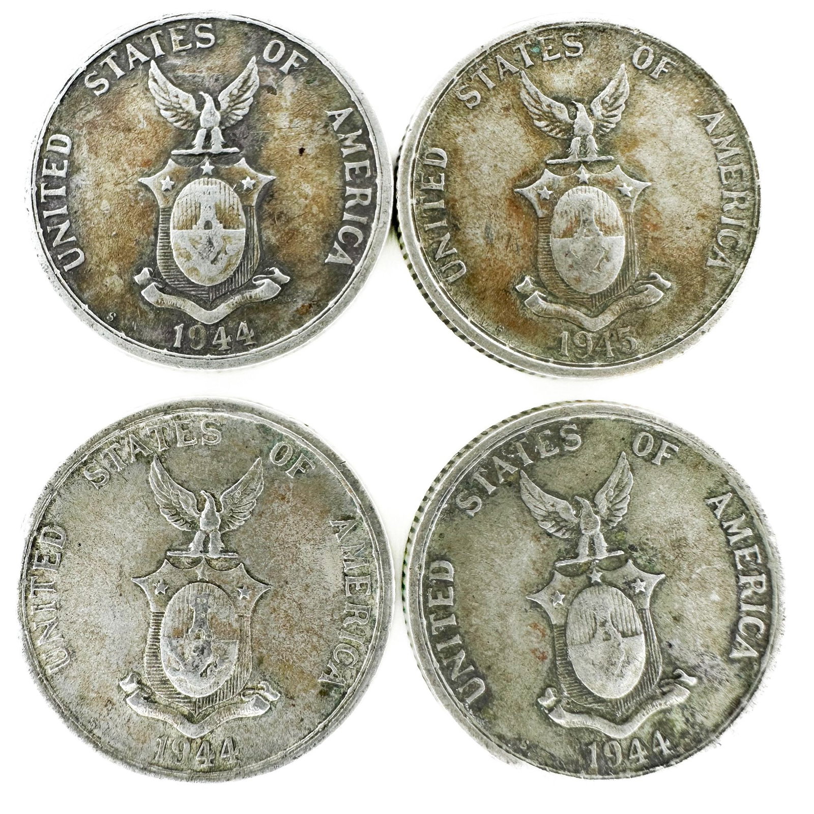 4 Philippines 50 Centavos 1944-S, 1945-S: Four wartime Philippines 50-centavo coins dated 1944-S and 1945-S. World War II-era issues. Shipping & Handling. All lots won by the same bidder are combined into one shipment via USPS Priority Mail (
