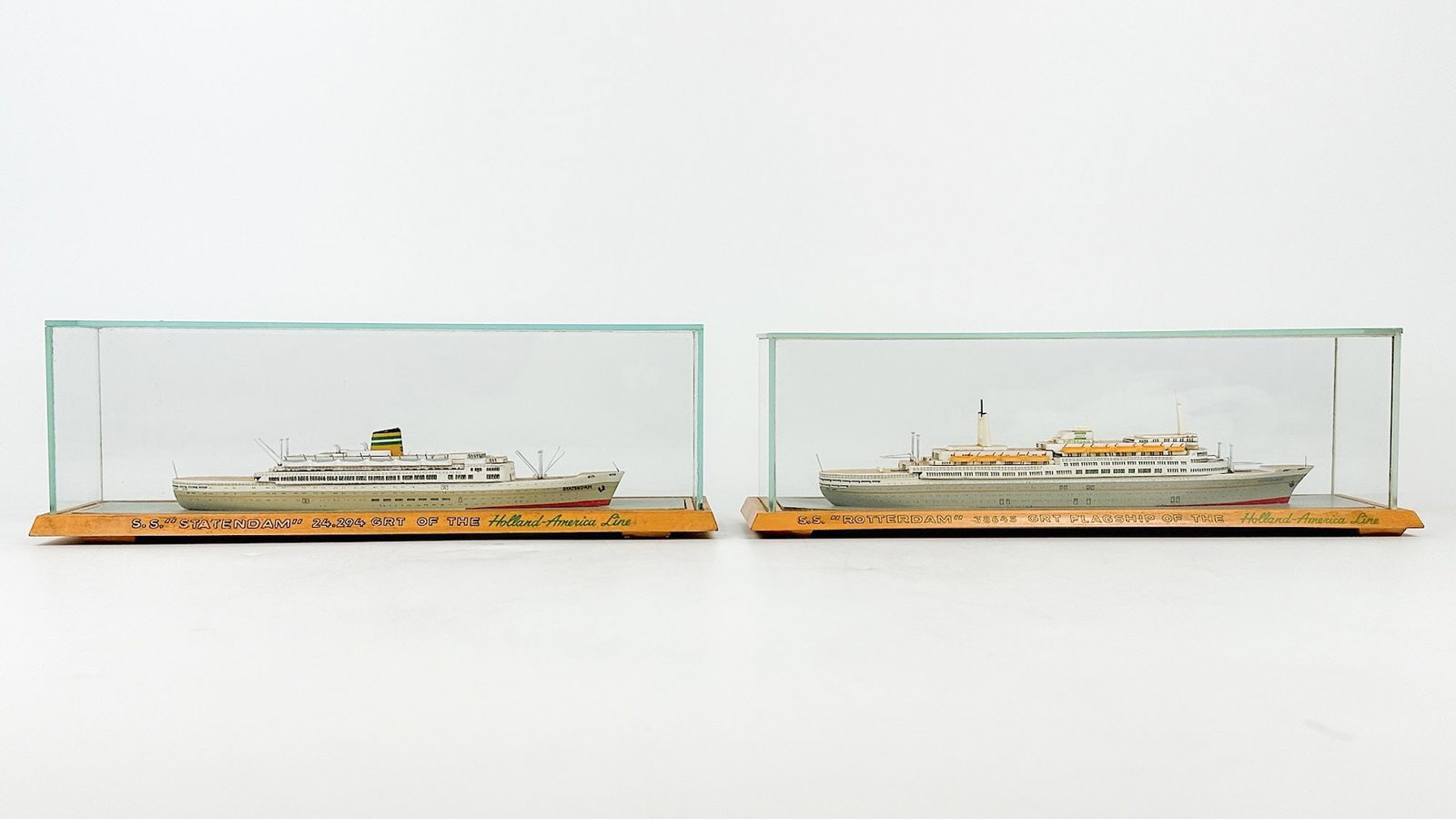 Two Holland America Line Travel Agency Ship Models, SS Statendam and SS Rotterdam: SS Statendam and SS Rotterdam. Each model is in a removable glass case. Textprinted along bases: "S.S. Statendam" 24.294 GRT of the Holland-America Line" and"S.S. Rotterdam"
