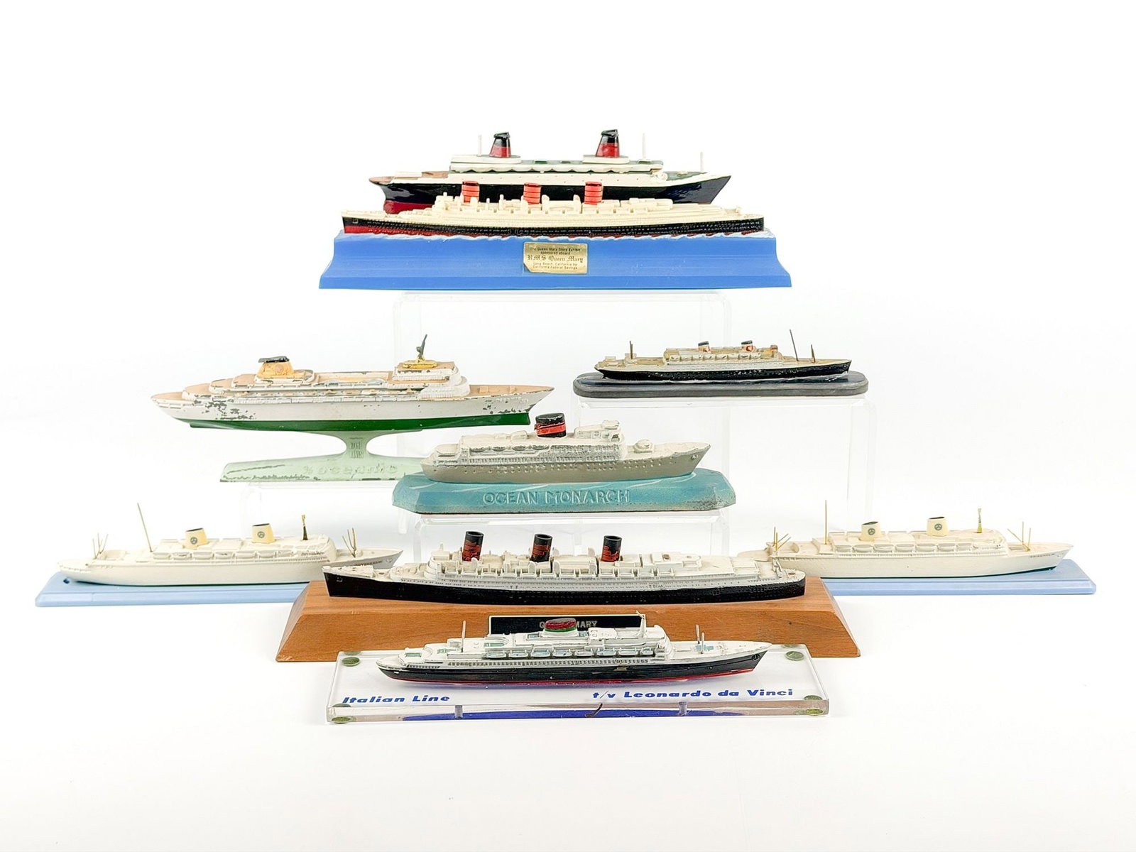 Lot of 9 Miniature Model Ships, MS Gripsholm, MS Kungsholm, Queen Mary, Oceanic, Ocean Monarch: Lot includes models of the MS Gripsholm, MS Kungsholm, RMS Queen Mary, SS Oceanic, SS Ocean Monarch, and SS Leonardo da Vinci ships. Dimensions: Approx. range: 1 in H x 7 in W x 1.5 in D. to 3.5 in H