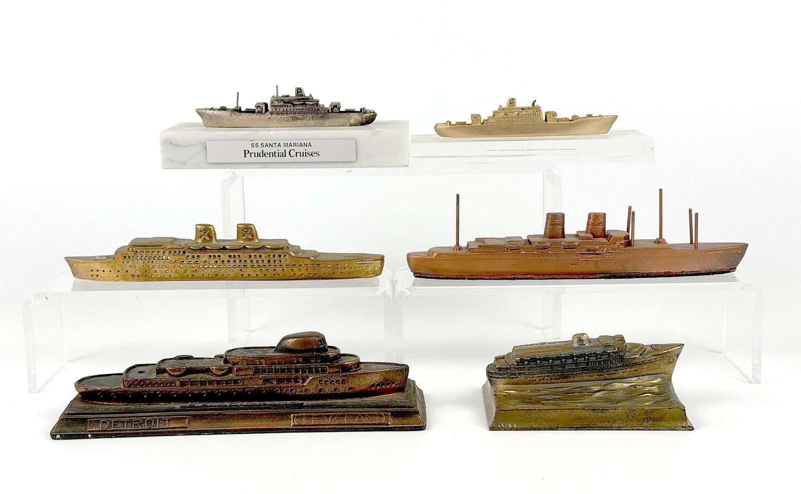 Lot of 6 Miniature Metal Model Ships, Aquarama, Olympia, Santa Magdalena, Atlantic, and Santa: Lot includes models of the SS Aquarama, TSS Olympia, SS Santa Magdalena, RHMS Atlantic, and SS Santa Mariana. Dimensions: Approx. range: 1.5 in H x 6.5 in W x 2 in D. to 1 in H x 3 in W x 1 in D.