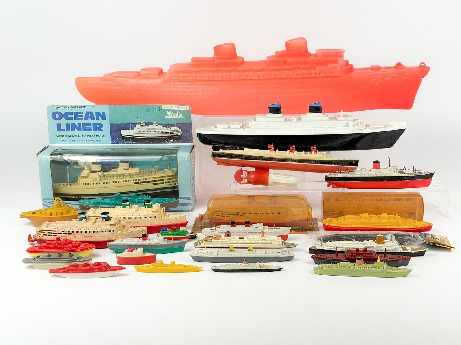 Lot of 27 Vintage Plastic Ocean Liner Models and Toys: Lot includes floating toys, motorized toys, whistles and more. Dimensions: Approx. range: 5.5 in H x 27 in W x 3.5 in D to 0.5 in H x 2.5 in W x 0.5 in D. Combined weight: 3 lbs 6 oz.