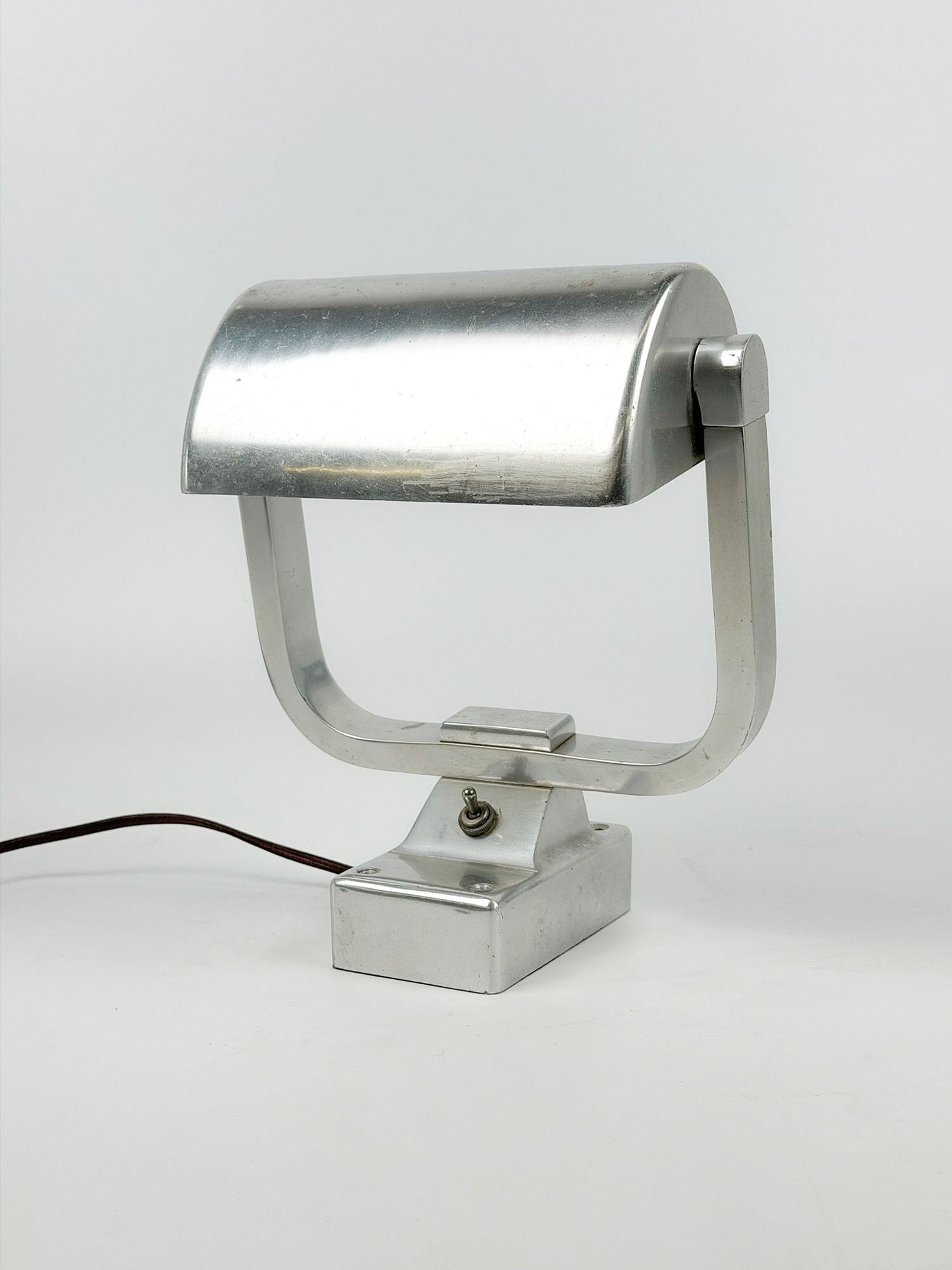 SS United States Heavy Aluminum Desk Lamp (Crew Area): Heavy aluminum desk lamp from the crew areas of the SS United States. Dimensions: Approx.11.5 in H x 9 in W x 6 in D.Weight: 2 lb 13 oz.