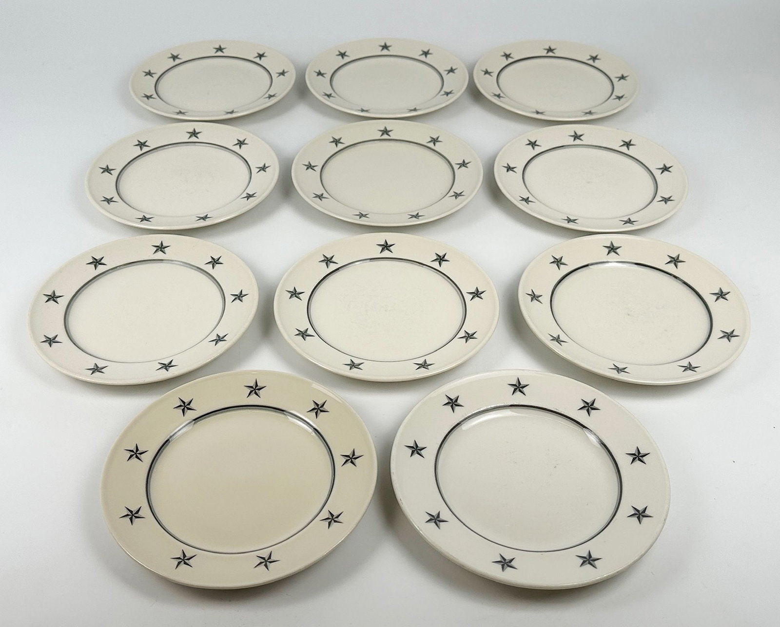 SS United States 7.5 Inch Plates Star Pattern, Made by Mayer China (11): Eleven 7.5 in plates, made by Mayer China for United States Lines. Dimensions: Each plate is approximately 1in H x 7.5 in Dia. Weighs 8 lbs.