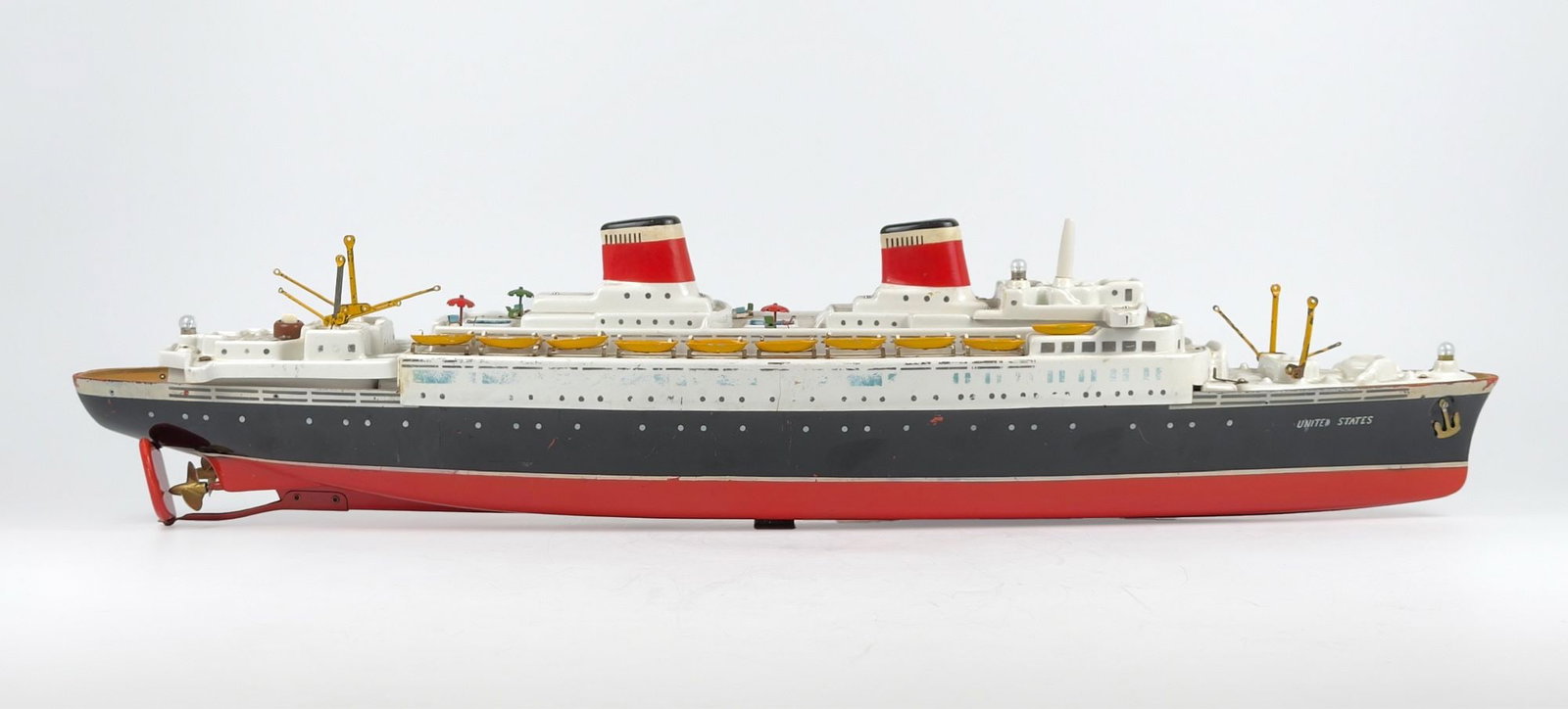 SS United States Large Battery-Operated Floating Figural Toy: Large metal and plastic battery operated floating figural toy. More an homage than accurate model. Dimensions: Approx. 8 in H x 35.5 in W x 6.75 in D. Weighs approximately 4 lbs 4 oz.