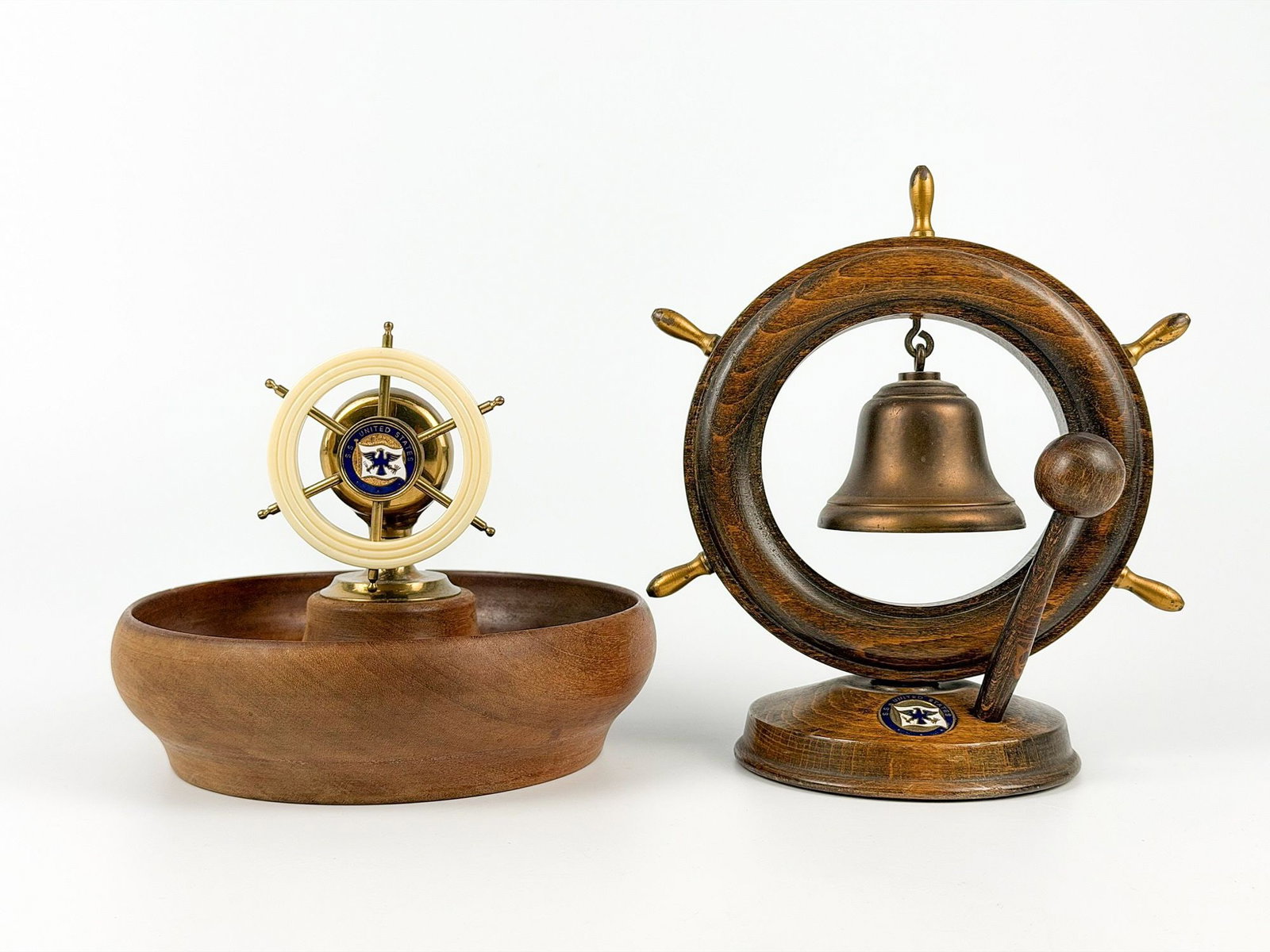 SS United States Wooden Souvenir Items (Nutcracker Bowl & Bell Stand): Two unusual wooden souvenir items: a wooden bowl with built-in Bakelite/metal ship's wheel nutcracker and company flag emblem, and a wood/metal ship's wheel figural bell stand with brass bell, wooden 
