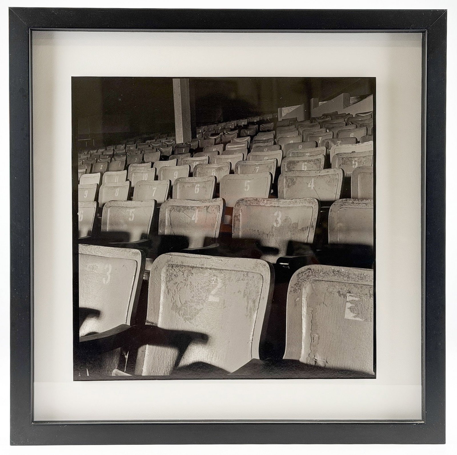 David Nagel (20th Century) Silver Gelatin Fiber Print, Stadium Seats Ed. 11/20: Titled Stadium Seats. Edition 11/20. Signed on the back of the frame. Depicts a black and white image of stadium seats. Dimensions: Visible image is approximately 10.75 in H x 10.75 in D. Frame is app