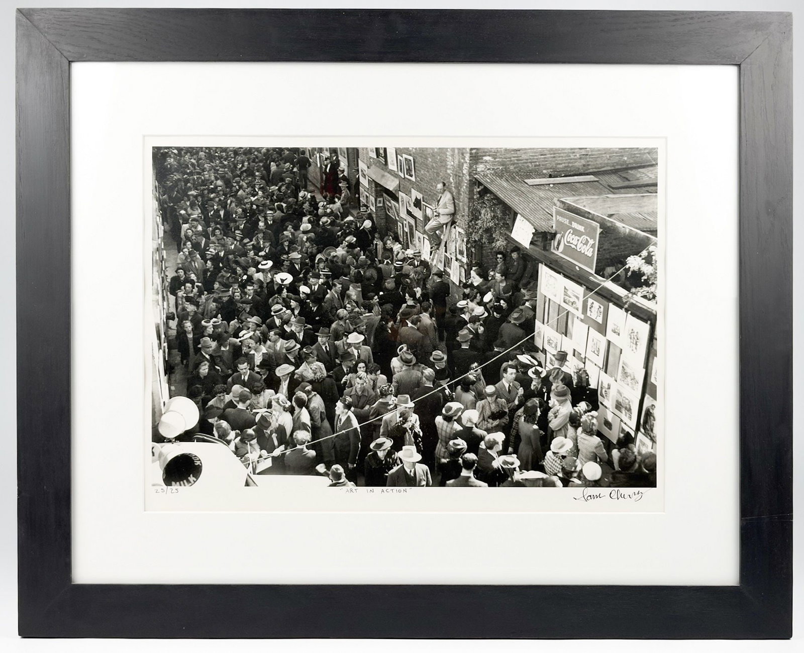 Sam Cherry (20th Century) Silver Gelatin Fiber Print, Art in Auction Ed. 25/25: Titled Art in Auction, edition 25/25. Signed in ink in the lower right corner. Depicts a crowded street scene with art auction. Dimensions: Visible image is approximately 14.25 in H x 19.5 in W. Frame