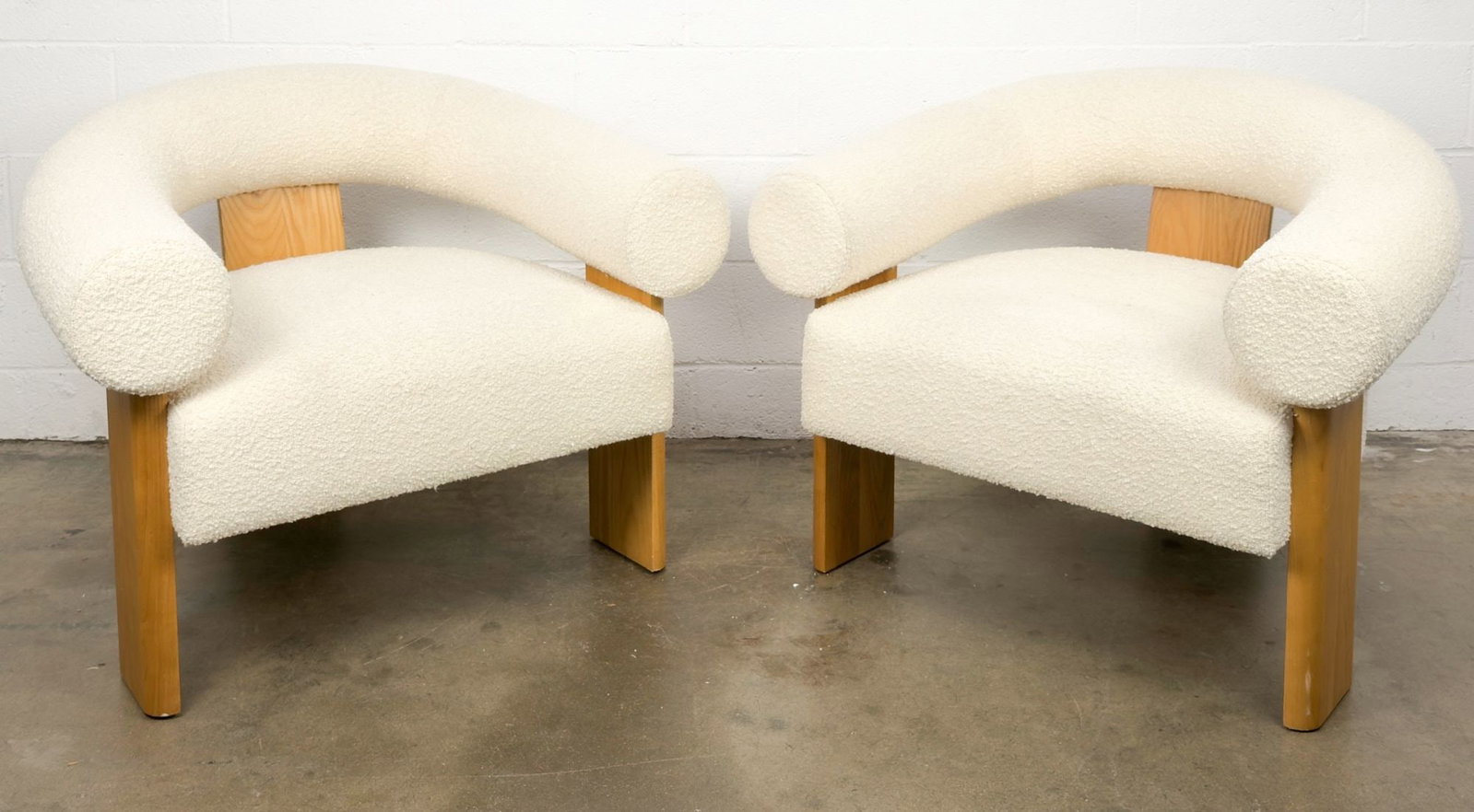 Pair of Lulu and Georgia Celeste Accent Chairs in Cream Boucle: Pair of chairs made of cream boucle upholstery and ash wood legs. Dimensions: Approximately 30 in H x 38 in W x 30 in D. LOCAL PICK UP INFORMATION:Wednesday, September 16, 10:00 AM-2:00 PM at 8059 Foo